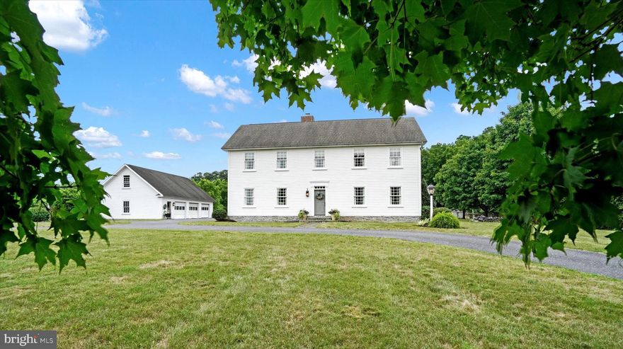 Impeccably designed modern Colonial featured in Country Living magazine! Extraordinary opportunity to become only the second owners of this luxury property. The stunning details of this home need to be seen to be appreciated.

The flooring is reclaimed random width pine repurposed from a barn in Connecticut, the windows are custom 9 over 9, one-of-a-kind sconces and light fixtures are abundant, the window candles are hardwired, and every single closet is oversized. 

Picture perfect, the kitchen is both stunning and functional complete with high-end finishes like solid wood cabinetry with inlaid doors, maple butcher block countertops, apothecary drawers, an appliance garage, double sink, under counter lighting, and built-in space for the fridge. The beamed ceiling adds to the richness of the space, and the peninsula was built to provide a spot for stools- a spot that is sure to become the best place for a quick meal or conversation while cooking.

An entertainer’s delight, the kitchen is open to the keeping room that serves as the heart of this home. The custom built-ins and pantry provide storage while the double sided fireplace constructed with stones from the property add warmth and beauty. The dining space is awash with natural light and is built to seat over 40+ people! The living room sits on the other side of the fireplace and showcases a classic style with crown molding, chair rail detailing, and a wall of built-in shelving that is both beautiful and practical. 

The second staircase serves as a private entrance to your primary suite. Spacious and tranquil, the focal wall is not just unique with a custom brick fireplace, it is also functional with double closet space and even room for a TV. The amenities continue in the attached bath with double vanities, deep soaking tub with jets, and separate shower. Not to be outdone, each of the additional bedrooms are spacious, comfortably fitting a king bed.  2nd floor laundry, with a utility sink and space to fold and sort, is a luxury you will wonder how you lived without! There are thoughtful touches throughout the home that emphasize the designer’s touch: each bathroom in the house has a custom created vanity to look antique and fit the space, the hall bath on the second floor has a custom paint finish, and one bedroom has a welcoming window seat.

Head downstairs to experience a finished lower level done right! The focal point of the space is undeniably the phenomenal wet bar complete with bottle storage, sink, and two-tiered sitting area. The open floor plan is elevated by sconce lighting, crown molding, and custom under stair shelving. The lower level bedroom and full bath are versatile and private- perfect for aging parents, older children, or even visitors. Looking for more amenities? 

Perfectly perched on a sprawling 5 acre lot, the spectacular outdoor living begins on the screened porch. The high-end detailing continues even here with a beadboard ceiling, double ceiling fans, and perfectly laid brick flooring. The sparkling in-ground 20x40 custom concrete and slate pool surrounded by a picket fence and herb garden is unlike anything you’ve ever seen. 

Every home needs good “bones” and this home boasts features meant for peace of mind including 400 amp service, geothermal heat, water softener, Bilco doors to the lower level, and double staircases. Unequalled, the detached garage is oversized in all the right ways. Each of the 3 bays accommodates any size vehicle. The surrounding space can be used for your tractor, RVs, bikes, and other toys. Even more opportunities for storage in the easily accessible 2nd floor of the garage. The driveway allows for easy overflow parking. 

The best kept secret about this home? It is only 20 years old! You will not find a more thoughtfully designed home with both modern amenities and unbelievable personality.