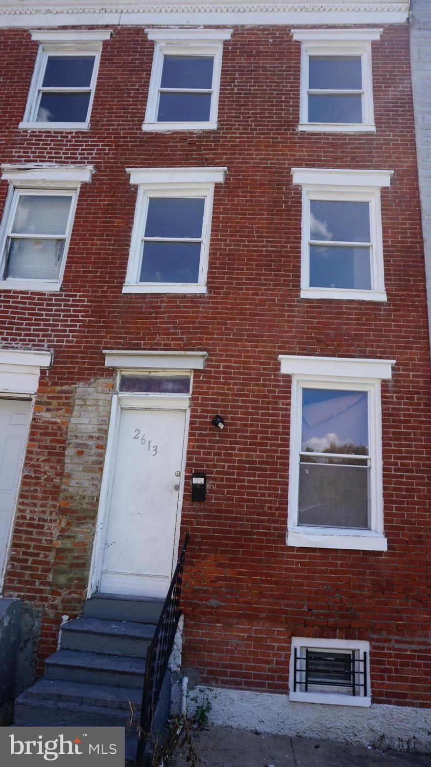 Hurry to this 4 story home including basement before it is gone.  4 large bedrooms above grade plus walk in closet and unfinished  basement for storage or additional future room. Features include new rubber roof, some new walls, 3 new doors, 6 new high end windows including all on the front and the kitchen, new fixtures, new laminate flooring in living and dining areas,  dry lock paint on rear exterior walls top to bottom, repointed brick, wood floors throughout painted a year ago with Behr floor paint,  5 year old recently serviced furnace  5 year old or so water heater, all working appliances convey including fridge, gas range, microwave and stackable washer/dryer. Fresh paint throughout a year ago needs to be touched up in some rooms. Quiet street with tons of off street parking in rear, for multiple cars, patio with fence on both sides just needs gate to close in. for pets...Hurry it will not last! Perfect for investors or someone looking for a bargain with the need for space. Purchase for less than rent! Call for further details! Rented recently for $1620/mth and section 8 pays way more.. It will need a new floor in in kitchen.  Photos are before renovations explained.  Major money invested since pictures. We have lead cert and rental license in hand.  Owner retiring....