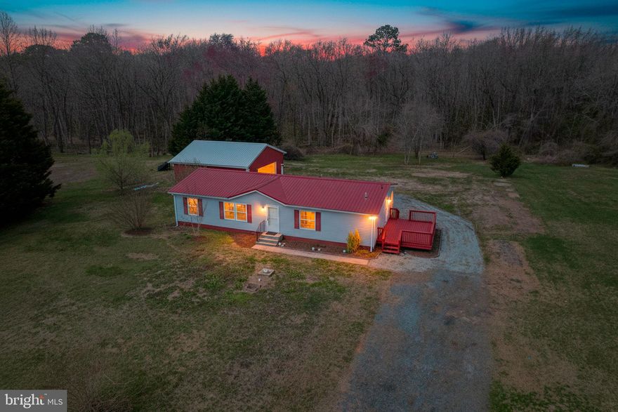 The epitome of country living. 3 Bed, 2 full baths, large deck, detached 2 car garage on 2.2 acres of land that backs to a creek. Then inside has been renovated and the outside has plenty of space to offer. The inside features all new flooring, paint, large primary bedroom and bathroom with a large tile shower. There are multiple walk-in closets, a living room, family room and dining area. The woodstove offers an alternate heat source and the laundry room offers plenty of room for additional storage. The kitchen has ample counter top space and looks out to the family room. Great for entertaining! Outside you'll find a large deck, detached 2 car garage, 2.2 acres of cleared land and a small creek which is great for relaxing by.  Schedule to see this home before it is gone!