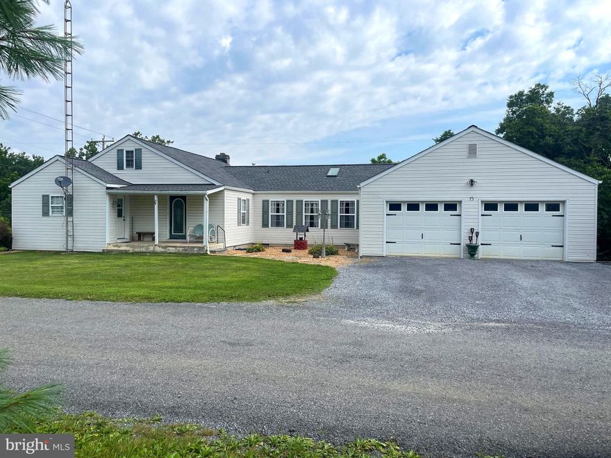 Welcome to 15 Ganotown East Rd.! Located in Back Creek Valley, this home sits on 2.567 UNRESTRICTED acres and has ample space to spread about with over 2,400 sq ft of living space with a full unfinished basement that could be turned into more living space or used as storage, a detached 3 car garage, and a pole building for any extra storage. As you enter the side door of the home, you are greeted with a formal living room. To the left you will find the kitchen and dining room. To the right of the formal living room you will find the half bathroom, a spacious family room with an office space off to the back, a sunroom that leads to a covered back deck, and then the laundry room and attached garage. Down the hall are two bedrooms with a hall bathroom as well as the primary bedroom with an attached primary bathroom. The attic could also be used for even more storage or possible finished living space. Outside you'll find a lovely open yard with a stream that runs through the property too! Don't wait to schedule a showing and take a look at all that this home has to offer! **TAX RECORDS SHOW FIREPLACE, THERE IS NO FIREPLACE OR WOODSTOVE** Sellers have recently sold some of the original land, the home is now on 2.567 acres** Sellers believe the original structure was built approximately 1956. The rest of the structure was built in 1998 per tax records.** Partial flood plain along creek.