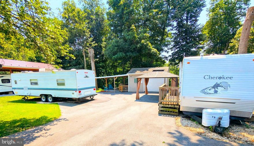 Check these great lots being sold together only.  Has two campers as well as a gazabo, garage with and lean to off the side of the garage.  Garage has a/c water with water heater to have hot water and electric.  This lot backs to trees.  Lots come with a 2007 Cherakee 38 ft camper travel trailer, washer, 2001 skyline 31 ft travel trailer that has a new frig and freezer.  Lot comes with tv, table and chairs in garage.  Don't miss out on these turnkey lots.  

This is a gated community, so you need to enter at the guard shack. Entry is not permitted without ID per the office rules. Bring IDs to the office or guard shack for visitor pass. THIS IS A SEASONAL CAMPGROUND! OPEN FROM APRIL 1 TO NOVEMBER 1. ** WELCOME TO RIVER BEND/SEASONAL LOT AVAILABLE TURNKEY** River Bend is a privately owned 400 acres recreational- vehicle camp resort with seasonal activities for members, families and guests. This great RV park is tucked away on the Upper Potomac River of West Virginia; River Bend is one of West Virginia's most popular family seasonal destinations.  Just a short drive from the Washington and Baltimore metro area. Open with utilities from April 1 to November 1. Lot owners have access to their property the entire year. *** Members Enjoy *** * Amazing views and wildlife, Potomac River access, Trails, Swimming pools, Mini-Golf, Youth center, Tennis and basketball courts, laundry facilities, convenience store, deli and lounge. *Bath houses throughout the park, boat ramp, bar and grill and even a church located on the grounds. River Bend also hosts numerous activities such as 4th of July fireworks, small carnival, bonfires, poker runs, horseshoe tournaments, car show, Halloween Trick or Treat and so much more.