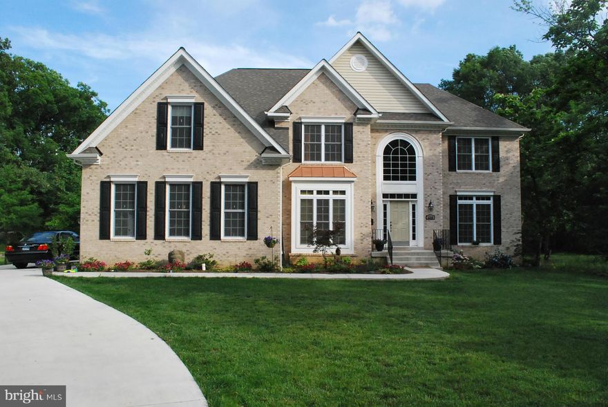 Elegance, fine finishes, and warmth come together perfectly in this spacious 4BR/4.5 bath Alexandria home w/3-car attached garage. Gourmet kitchen w/granite, stainless appliances, dbl oven, beautiful maple cabinets. Office, lg living area, fully-fin 2,000 SF basement w/xtra den w/closet (potential in-law suite), addl. media room. 6,000+ SF of living space. I395/Mark Ctr. 2 min.