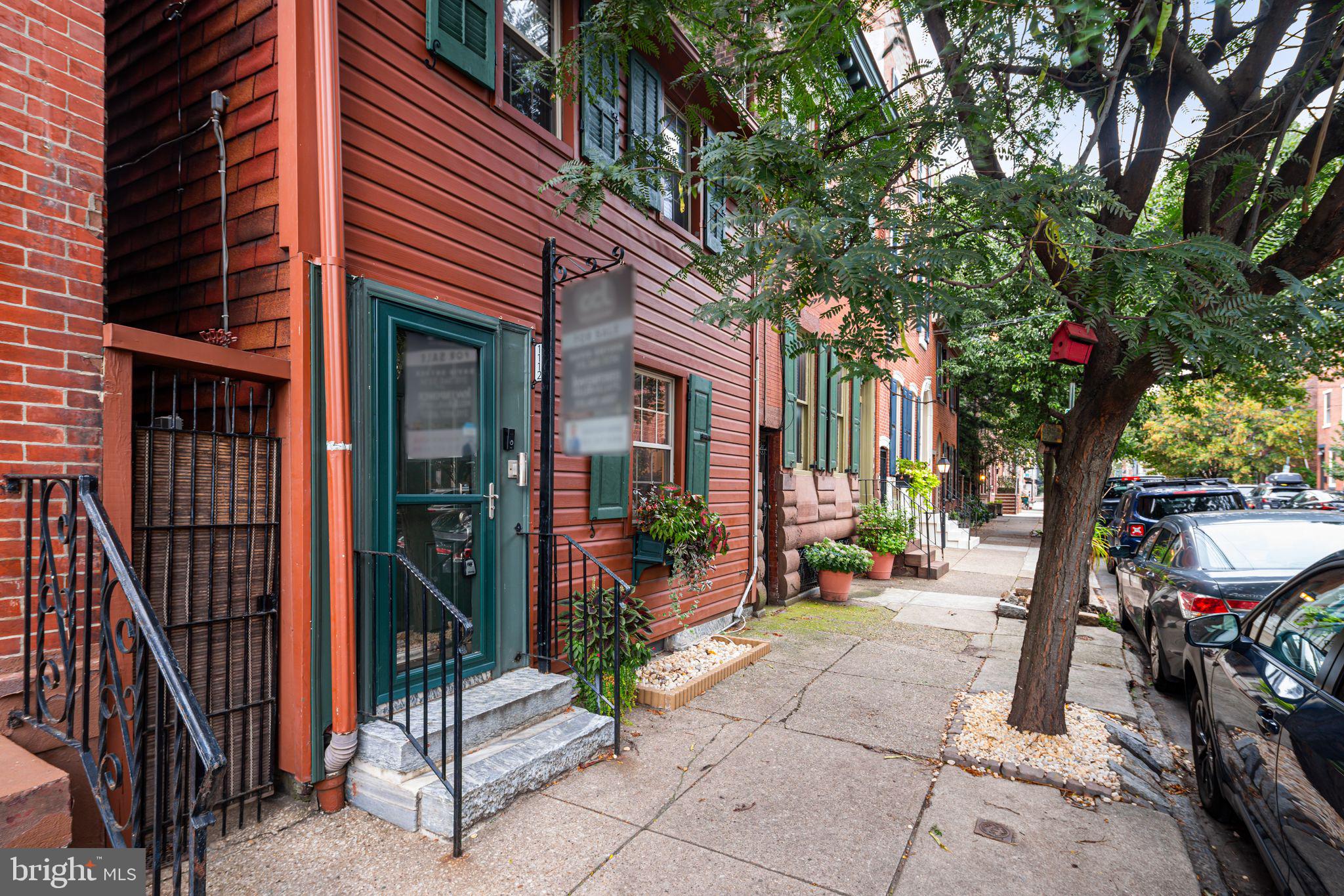 Welcome to 1112 Marlborough Street, a beautifully renovated 3-bedroom, 2-bathroom townhome located in the highly desirable Fishtown neighborhood.
Originally constructed in 1886 and thoughtfully combined from two historic homes, this property seamlessly blends timeless architectural details with modern upgrades. The main level features a spacious living room with original hardwood flooring, four restored (non-functional) fireplaces, and a distinctive exposed stairwell highlighted by period lighting and glass enclosure. The formal dining area leads into an updated kitchen equipped with stainless steel appliances, tile backsplash, and a walk-in pantry. A rear door opens to a landscaped private backyard - a rarity in the city!
The second floor offers a generously sized primary bedroom, a full bathroom, and a secondary bedroom with an en-suite bath. The finished third floor provides flexible space suitable for a third bedroom, home office, or playroom. Additionally, a private staircase from the primary bedroom leads to this upper level, making it an ideal option for a home office or expansive walk-in closet.
The fully finished basement includes exposed stone walls, a dedicated laundry area, and ample storage throughout.
Additional features include new HVAC (installed 2022), new kitchen appliances, new washer, and updated landscaping with sod replacing asphalt in the rear yard.
This unique residence offers easy street parking, including convenient 24/7 availability under the nearby overpass, and is ideally situated to access Fishtown’s renowned dining, shopping, and public transportation options.
A rare opportunity to own a meticulously maintained home that offers both historic charm and contemporary comfort in one of Philadelphia’s most vibrant neighborhoods.