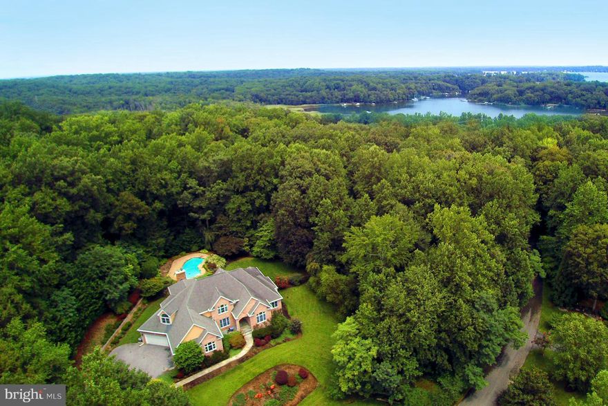 You will want for nothing and enjoy everything about this stunningly beautiful home in sought after/water privileged Belvoir. Original owners meticulously designed, cared for and updated this home all while filling it with love and laughter along the way. Resort like pool with lush landscaping and hardscaping. Spa like master bath. Full in-law/nanny suite in basement. 4 car garage!!!