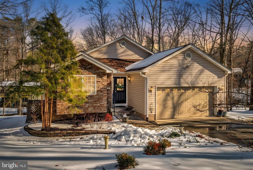 Welcome to 112 Birchside Circle in the amenity-rich Lake of the Woods community!  This spacious 4-bedroom, 3 full bath home offers room to spread out, gather, and truly enjoy lake living. From the moment you step inside, you’re greeted by a mix of beautiful ceramic tile, sturdy hardwood floors, and an abundance of light pouring in. Step out onto the expansive deck to relax, entertain, or take in the scenery. The primary suite also features private access to the deck: imagine stepping outside each morning to sunshine and tranquil views of the water in the distance. The kitchen offers a functional layout ideal for everyday meals and entertaining alike. Downstairs, the fully finished basement opens to an enormous rec room, perfect for game nights, movie marathons, or hosting gatherings. You’ll find the fourth bedroom here with an impressively large closet, along with a convenient kitchenette area that makes the lower level ideal for guests or extended stays. The basement walks out to the backyard, offering even more room to enjoy the outdoors. Complete with a 2-car garage and located within a well-established, amenity-rich lake community, this home offers the lifestyle you’ve been looking for—scenic lake views, generous space, and versatile living areas without the maintenance of direct waterfront living. 
112 Birchside Circle is ready to welcome you home! 

Nestled in a private, secure, gated community, Lake of the Woods is a paradise of possibilities. With two lakes, a golf course, an equestrian center, fire and rescue services, and even a church within its bounds, this community offers a diverse range of activities. From boating, water skiing, kayaking, and golfing to the simple joy of soaking in mesmerizing views from the clubhouse, deck, yard, or beaches, there's something for everyone. Engage your interests by joining over 60 clubs and organizations, or perhaps indulge in a game of bridge or contribute your talents as a volunteer. Lake of the Woods truly caters to your lifestyle.

Located in Orange County, enjoy the added advantage of low real estate taxes. With home prices spanning from $300,000+ to over $1,800,000, Lake of the Woods is the ideal haven for both full-time residents and weekenders. Don't just take my word for it – come and see for yourself! Allow me to guide you through a tour of Lake of the Woods, showcasing the very essence of what makes this community so special. Experience firsthand the captivating charm of Lake of the Woods!