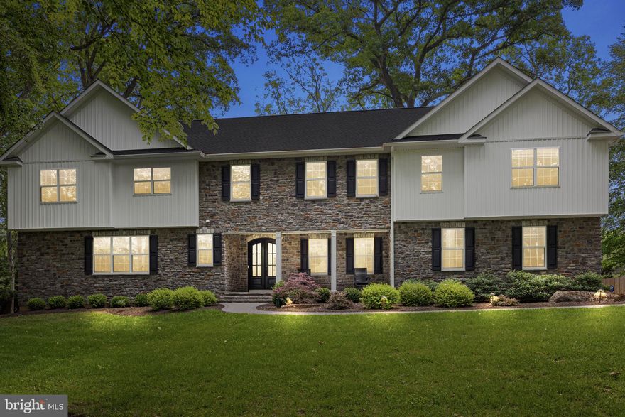 Nestled on over an acre of lush, tree-lined grounds, this stunning custom-built home offers the perfect blend of elegance and privacy. A long, private driveway winds through mature landscaping, creating a dramatic approach to the stately stone-front exterior. The facade showcases rich textures with stonework  beautifully complemented by a covered front porch with classic columns—perfect for relaxing in a rocking chair and enjoying the serene setting. The grand double front doors with arched glass panes make an unforgettable first impression.

Step inside and prepare to be impressed by the bright and elegant interior of this beautifully designed home. The welcoming foyer showcases crisp white trim and wide-plank engineered hardwood floors. To the right, a sophisticated space is currently utilized as a home office, offering abundant natural light through oversized windows. With the addition of a closet, this versatile room could easily serve as a first-floor bedroom—perfect for guests or multigenerational living.

The open-concept layout flows effortlessly into a breathtaking two-story living room where soaring ceilings, floor-to-ceiling windows, and a cozy gas fireplace take center stage. This impressive space is ideal for both relaxing evenings and hosting gatherings, with sight lines that extend into the kitchen and dining area.
The chef’s kitchen is anchored by a massive 10 foot, seamless, quartz-topped island.  It features white shaker-style cabinetry, stainless steel professional-grade appliances including a FORNO double oven and 8 burner gas range, a beverage fridge, and a deep farmhouse sink. The kitchen also offers a huge walk-in pantry, built-in microwave, and designer lighting that adds warmth and elegance.

Adjacent to the kitchen is a light-filled dining area perfect for casual meals, with sliding glass doors leading out to the expansive paver patio. For more formal gatherings, a separate dining room offers refined touches like custom wainscoting, crown molding, designer light fixtures, and a convenient bar area with wine storage.
Upstairs, retreat to the luxurious primary suite, featuring a spacious sitting area, a massive walk-in closet with custom built-ins, and a spa-like en suite bath. Here, you'll find dual vanities, a freestanding soaking tub, and an oversized glass-enclosed shower with dual shower heads.
A private princess suite includes its own walk-in closet and full bathroom, while two additional bedrooms—each with large walk-in closets—share a beautifully appointed hall bath. A second-floor laundry room adds convenience, while a catwalk-style hallway overlooking the two-story great room, enhances the home’s open and airy feel.
The finished basement expands the living space dramatically and is virtually staged to showcase its full potential. A large unfinished area—perfect for a home gym or storage—includes a private ramp leading directly to the garage, offering a separate entrance/exit for ultimate flexibility.
Step outside to the backyard and discover an expansive paver patio that provides space for grilling and entertaining—complete with a built-in retaining wall and surrounded by serene greenery for added privacy. 
Ideally located in the heart of scenic Buckingham Township, 4245 Mechanicsville Rd offers the perfect balance of privacy and convenience. Nestled within the award-winning Central Bucks School District, this home is just minutes from historic Doylestown Borough, offering access to charming shops, dining, museums, and parks. Commuters will appreciate the easy access to Route 202, Route 413, and the Doylestown SEPTA station, providing a seamless route to Philadelphia and a direct connection to New York City in just under 90 minutes. Enjoy country living with city access in one of Bucks County’s most desirable and picturesque locations. Don’t miss the opportunity to own this exceptional property that offers the perfect blend of luxury, comfort, and convenience.