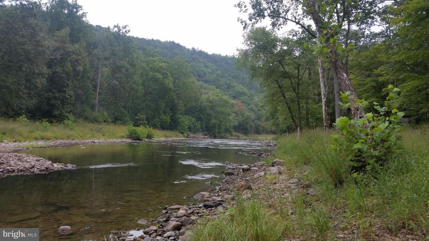 8.17 acres on the Cacapon River, 400' of river front nice level land out of the flood zone, ready to build.