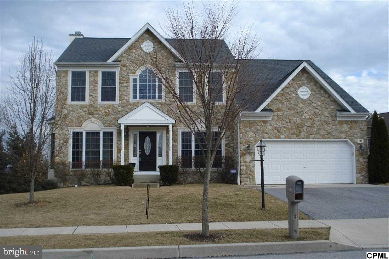 Meticulous Home featuring Dining Room with trey ceilings, Kitchen with stainless steel appliances, dining island and butlers pantry. Family Room with floor to ceiling stone fireplace. Sunroom and first floor office. Oversized trex deck and stamped patio.Exposed walk out basement and level back yard. Four bedrooms and two and a half baths. Master Bedroom has cathedral ceiling, two walk in closets and spacious master bath.