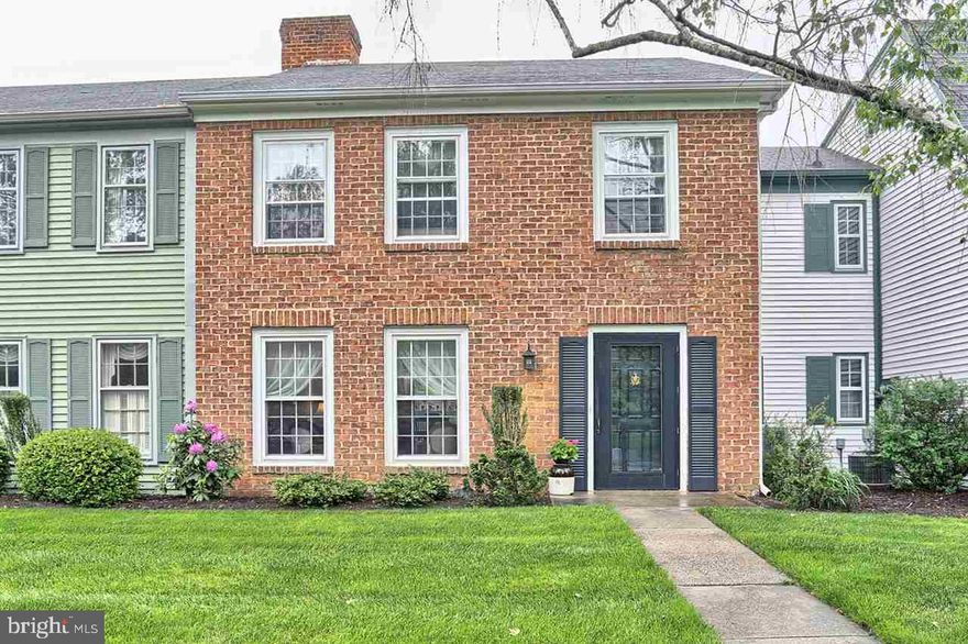 Charming 2 Bedroom home with a large MBR and new flooring and walk in shower in the master bath.  The MBR with a wall of closets and storage.  This home is surrounded by professional landscaping, walkways, center area of community for events and benches in common areas.  Relax in your private courtyard among the raised flowerbeds and herringbone brick patio.  A beauty you'll be proud to show and enjoy.