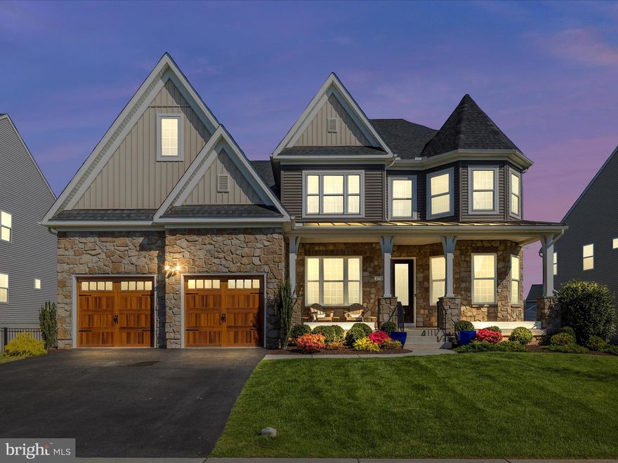 Welcome to this exceptional residence at 2729 Moon Shot Ln in the popular community of Kellerton, blending sophisticated design with modern functionality. The main level captivates with 10’ ceilings, rich hardwood floors, and abundant natural light. The two-story family room features a coffered ceiling, built-ins, and a dual-sided fireplace shared with the expansive rear deck. The gourmet kitchen boasts custom cabinetry, a grand island, quartz countertops, a farm sink, Wolf six-burner gas cooktop, wall oven, and a Sub-Zero refrigerator. Host elegantly in the formal dining room or work efficiently in the dedicated office. The main-level primary suite indulges with a spa-inspired bath, including twin vanities and a walk-in shower. The upper level offers three generously sized bedrooms and a versatile second-level family room. The lower level impresses with a wet bar, recreation room, and bonus room, ideal for entertaining. Extensive moulding and solid core two-panel doors elevate the home’s refined aesthetic throughout. Exterior living shines with a gracious front porch perfect for relaxing, a spacious rear deck accessed via glass doors from the kitchen, and a fully fenced rear yard. The deck, offering serene mountain views, descends to an expansive hardscape patio with a fire pit, creating an inviting outdoor retreat. Experience Kellerton’s premier amenities, just steps away, including a community pool, a clubhouse with exercise room, sidewalks, tot lots, pavilions, and a dog park. Ideally located with easy access to commuter routes and minutes from Downtown Frederick, this home delivers luxury and lifestyle in equal measure.