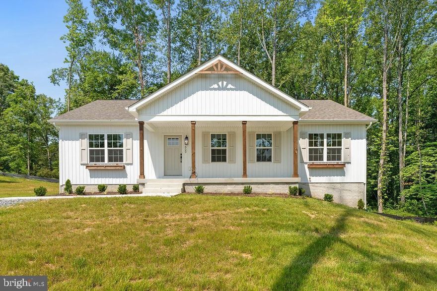 Completed new construction – The Boxwood by Ironwood Homes – perfectly situated on 0.29 acres right in town. This stunning 5-bedroom, 3-bath ranch home blends timeless country charm with modern elegance. The open-concept floor plan features soaring ceilings and exposed natural beams that flood the home with light and warmth, creating an inviting and airy atmosphere.

The heart of the home is the beautifully designed kitchen, complete with quartz countertops, a farmhouse sink, stainless steel appliances, and stylish custom lighting. The luxury continues into the spa-inspired primary bathroom with a freestanding tub, upscale tilework, and high-end finishes throughout.

Luxury vinyl plank flooring, adding durability and style. The fully finished basement includes two additional bedrooms, a full bath, and a spacious rec room—ideal for guests, entertaining, or multi-generational living.

Every detail has been thoughtfully curated to give this home a truly custom feel. Don’t miss your chance to own this exceptional property in a desirable location—close to town, yet offering privacy and modern comfort.