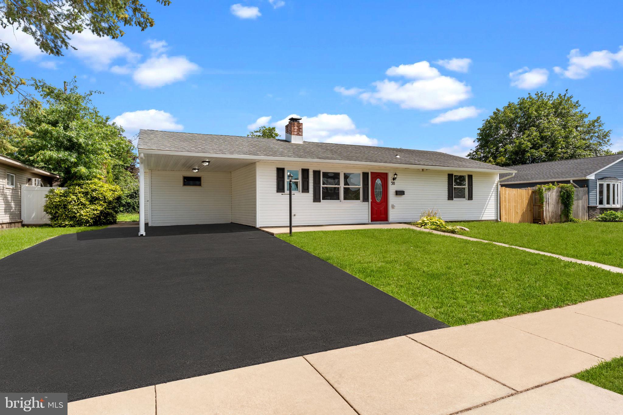 WOW! This totally renovated 4 Bedroom, 1.5 Bath expanded custom ranch with open floor plan located in desirable Pinewood Section of Falls Township is just what you've been searching for!! Enter this home and immediately be impressed by the brand-new kitchen with laminate flooring throughout and custom fireplace. Kitchen has been redesigned and features recessed lighting, 38" white shaker cabinets with and soft close doors/drawers, under cabinet lighting, corner glass lighted cabinet, glass tile back splash, granite counter top, drop-in stainless sink with pullout faucet and garbage disposal with counter air switch. Stainless Frigidaire appliance package includes side by side refrigerator with ice/water in door, glass cook top range, built in microwave and dishwasher and half bath located off kitchen. The updated Living room features, recessed lighting, remote ceiling fan, redesigned floor to ceiling fireplace with faux stacked stone, glass fireplace doors, bluestone hearth, granite shelf and lighted display cabinet with glass shelving, accent trim package which features crown molding, chair rail, shadow box and oversized base molding. Bonus room located off of Living room with crown molding, recessed lighting, domestic hot water heater, circuit breaker box could be used for extra storage or office etc. Addition off of living room features crown molding, ceiling fan, recessed lighting, and French door to rear patio and a fourth bedroom with crown molding and ceiling fan. Main bedroom with crown molding, recessed lighting and ceiling fan and two additional bedrooms with crown molding and ceiling fans Full hall bath with crown molding, fiberglass tub with ceramic tile walls, glass shelves, dual flush toilet, white shaker vanity, and ceramic flooring. The hall laundry closet is set up for stackable laundry center. Exterior features architectural shingled roof, maintenance free Dutch lap vinyl siding, replaced windows, new 4 car macadam driveway with one car carport and storage room, fenced-in rear yard with cement patio, front and rear electric and hose bibs, landscaping to be done prior to closing and lamp post with photo eye and electric outlet. Extras to include Fujitsu min-splits (2 units) w Bluetooth feature and remote control, 50-gal Rheem Performance Platinum domestic hot water heater with Bluetooth leak detection., plumbing beneath the slab from kitchen sink to hall bath has been replaced with new PVC and Pex pipe and new pull-down attic stairs. Fresh paint and six panel doors. This home is conveniently located with one block of Walt Disney Elementary Schools and Falls Twp Community Pool and playground. Also convenient to major roads , bridges, Levittown train station and shopping center. Make this home yours! Ready for quick settlement! Just pull up the moving truck and unpack!