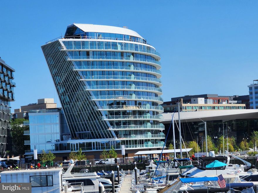 OPEN HOUSES CANCELLED. Welcome to Amaris, an exclusive waterfront, pet friendly residence in the heart of The Wharf. This sophisticated 2-bedroom, 2.5-bathroom home offers 1,411 sq ft of refined living, with an open-concept kitchen, dining, and living area framed by soaring floor-to-ceiling windows. A sweeping wraparound balcony captures serene views of a charming park and the river, blurring the lines between indoor and outdoor living. This residence includes two underground parking spaces and private storage. Residents of Amaris enjoy unparalleled amenities, including a 24-hour attended lobby, valet parking, resort-style indoor pool and spa, state-of-the-art fitness center, and expansive roof terraces with breathtaking vistas. Just a five-minute walk to the Waterfront Metro, Amaris is perfectly positioned amid the Wharf’s acclaimed dining, vibrant nightlife, and celebrated music venues—where luxury meets convenience.