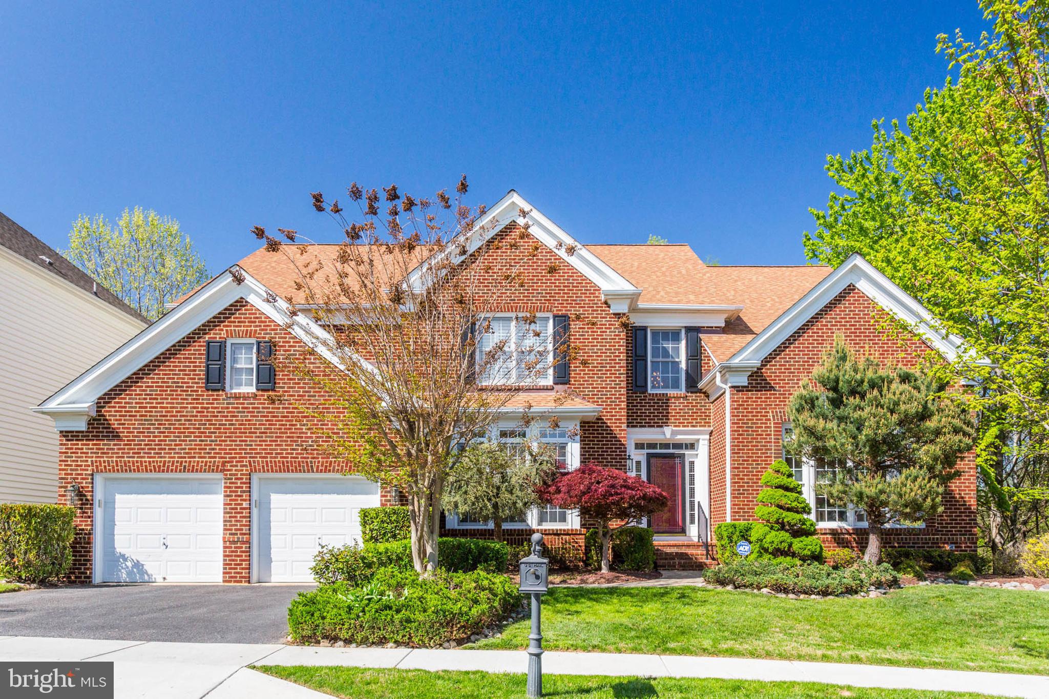 Welcome to this impressive Pulte “Kendall” model home in the sought-after Fallsgrove community. This house sits on a premium, one of the kind lot backing and siding to the Forest Conservation area ($100K builder lot premium). Inside this grand floor plan features over 7,000 sqft of finished space with custom decorator touches that will delight and impress. These include a dramatic two-story entry foyer with overlook, large living room with 12 ft ceilings, large family room with coffered ceilings and a stone fireplace, and a stately library. The spacious gourmet kitchen with a breakfast area includes 42” customized cherry cabinets, granite countertops, large granite island, a brand-new stainless steel GE Profile cooktop with a brand-new externally exhausted microwave hood. On the upper level, there are sizable bedrooms and an impressive primary bedroom suite with sitting area and a marble fireplace. Not to be missed is the primary bath with raised cherry vanity with a brand-new countertop, sink and faucets, jetted tub and extensive walk-in closet. The lower level offers an audio/video pre-wired home entertainment/theater room and exercise room with a wall of windows. The lower level also includes a 5th bedroom with bathroom, a walk-in closet and a large unfinished storage area. The rear of the house is an outdoor entertainment oasis with major improvements such as an expansive 850 sqft TimberTech maintenance-free composite deck and a 435 sqft flagstone patio. Summary of key features: 5 bedrooms, 4 full bathrooms, & 2 half bathrooms; New 25-year roof (August 2017); Hardwood floors, decorative columns and extensive custom millwork; Hardwood staircase with decorative wrought iron balusters; Brand-new GE Profile stainless steel cooktop and brand-new stainless steel externally exhausted Microwave hood (April 2025); Brand new master bathroom countertop, sink and faucets (April 2025); Home Theater/Entertainment room; Jacuzzi/jetted tube in master bedroom; Whole house wired home security system; Whole house wired intercom system; 7- zone lawn sprinkler system; Premium Forest Conservation lot. Fallsgrove is a walkable and amenities-rich community featuring a swimming pool, gym, club house, and playgrounds. Enjoy ample parks, biking/hiking trails, and tennis courts nearby as well as the Thomas Farm Community Center. Walk to restaurants, shops, salons, and banks, including Starbucks and Safeway, at the Fallsgrove Village Center. Convenient to I-270, MD 200 (ICC), two metro stations, Shady Grove Hospital, University of MD Shady Grove campus, I-270 Biotech Corridor, Rio, Downtown Crown & Rockville town center for endless entertainment & dining options.