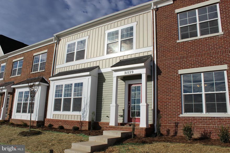 New Dahlgren Model lives like a single family! 2 car rear load garage, 2505 sq ft on 2 levels! Main level upgraded with hardwood floor. Kitchen is finely appointed with granite counters and stainless steel appliances.   4 BR, 2.5 bath nice floor plan