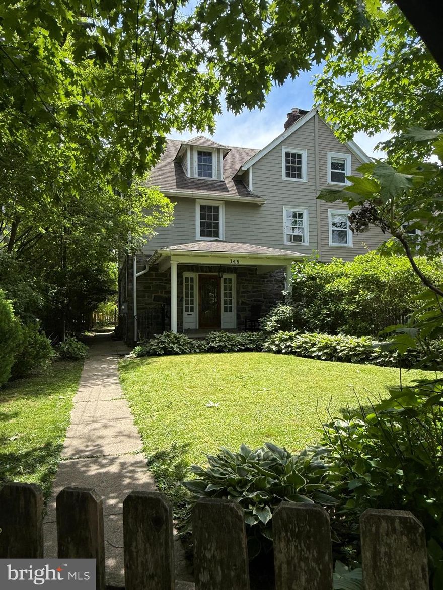 NOTE: Property is available August 1st, 2026. Nestled on a fully fenced lot with a lush, secret-garden feel, 145 Linwood Avenue in Ardmore is a charming 4-bedroom, 1.5-bath home filled with character and comfort. Step onto the inviting covered porch and into the sun-drenched living room, highlighted by a beautiful wood-burning fireplace. The adjoining dining room exudes classic appeal with original floor-to-ceiling, glass-front built-ins.

An open flow leads to the kitchen, thoughtfully separated by a marble-topped island offering extra storage and seating. The kitchen features ceramic tile flooring, elegant white cabinetry, stainless steel appliances, and generous counter space.

Upstairs, you’ll find four spacious bedrooms, all freshly painted in neutral tones and equipped with ceiling fans, along with a full bath featuring timeless subway tile and a tub/shower. A walk-up attic provides excellent storage potential, complemented by a large outdoor shed.

The finished basement adds valuable living space, including a cozy gas fireplace and a laundry room equipped with front-loading machines, a utility sink, and storage cabinets.

Outside, the expansive backyard and patio create an ideal setting for enjoying crisp fall evenings. All of this is just a short walk to Ardmore’s beloved amenities, including restaurants, Suburban Square, and the regional rail line. Located in the coveted Lower Merion School District.