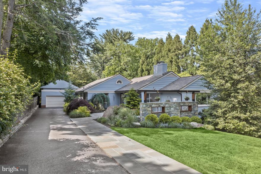 This stylish contemporary home offers convenient one-level living and a swimming pool in an idyllic setting of almost half an acre. It's just off Jones Mill Rd, with easy access to the beltway and barely 20 minutes to downtown DC.  The home has large,  sun-filled rooms with multiple skylights and huge windows overlooking landscaped grounds with elegant water features.  The main level features a living room with fireplace, a separate dining room, an expansive skylit  kitchen/family room arrangement, two guest rooms (one now set up as an office)  with shared bath and a wonderful owners' suite with a wall of glass that opens directly onto a gorgeous, very private landscaped garden and terrace with swimming pool.  The finished lower level has a second fireplace and natural light from large, above-ground windows plus a full bath, bonus room (could be studio or office) and laundry.  There is ample storage throughout, and a large two-car garage.