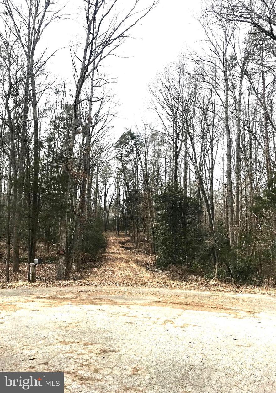 Rare opportunity to own in Oak Crest Estates. NO HOA!!  Beautiful 5.99 acre house site with well and septic in place.  Located at the end of a cul-de-sac this lot is both peaceful and private.