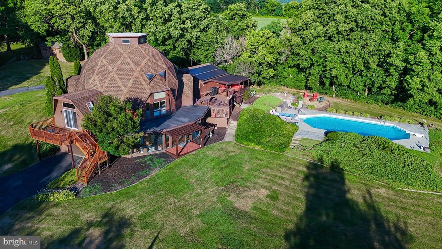 Buyers financing fell through!  Lovingly named the "Smithsburg Country Club", this is truly a one-of-a-kind property as it has everything you need for privacy and enjoying the good life! Nestled on over 7 .42 acres of picturesque rolling land, this unique contemporary home is located at the end of a long private lane. Sit on your covered porch and enjoy all life has to offer. The Estate boasts 20x40  pool and two pristine professional grade pickle ball courts with lights! The perfect get away from the rat race can be used as VRBO for a great money maker. The interior has been totally remodeled featuring a gourmet kitchen with granite counters, master on the main level with two  additional bedrooms upstairs and a bonus room on the third level! Lower level is fully finished with walkout to garage and additional enclosed porch with hot tub. With 3 garage spaces in total and serene natural surroundings, this extraordinary property is truly one in a million! Act fast- this incredible opportunity won't last long! Come and make it yours today!