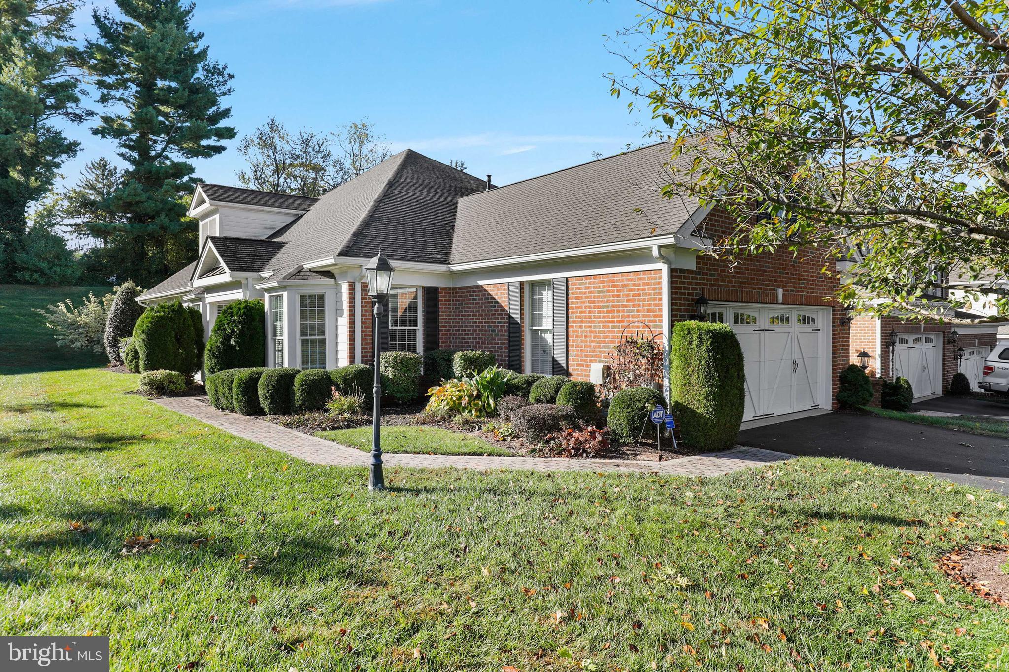 Fabulous end unit villa in 55 +Tollgate Village! This spacious home features 3 bedrooms and 3 full baths. Open kitchen with 42 inch cabinets, granite counters, stainless steel appliances and peninsula with seating for four. Spacious family room with gas fireplace and patio door to a paver patio. Formal living room and dining room off the two story foyer. First floor primary bedroom with tray ceiling, walk-in closet and en suite bath with double vanity, sunken tub and walk-in shower. Additional bedroom/office and full bath on main level. Upper level loft and third bedroom with en suite bath. HOA fee includes lawn care, snow and trash removal.