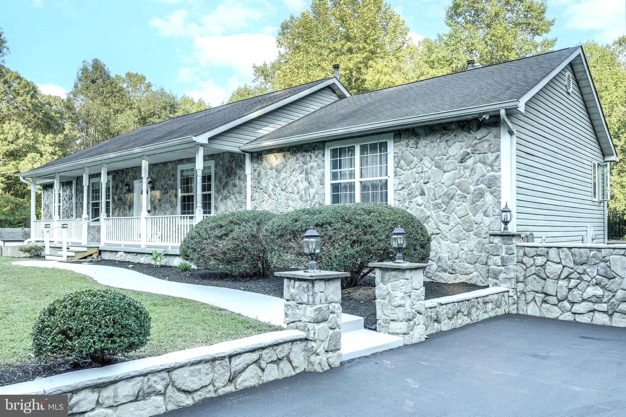Multi Generational Property!!! Looking for Privacy with All the Amenities? Almost 20 acres on a private road. This 6 bedroom, 4 bathroom, open contemporary stone front home has it all. Imagine greeting guests while sitting on this 6’ x 40’ front porch and enjoying the beauty and tranquility of nature.
This open floor plan is for the entertaining hosts. The kitchen with large granite island has seating for 6. Gas cooking and built in oven for the gourmet chef. The corner gas fireplace is conveniently located where many of the areas can enjoy the warmth and ambiance.
The owners main bedroom with ensuite is located on the main level. Large walk-in closet for plenty of storage. Private gas fireplace for cozy evenings in your private suite. Walk-out french doors to the 12 x 70 deck overlooking the private yard and gunite pool.
There are 3 additional bedrooms, 2 full baths, washer/dryer area, and hardwood floors throughout the main level.
The lower level is a separate living space for the In-Laws. 2 bedrooms, 1 bathroom, kitchenette, bar, and great room with gas fireplace. Also a wood stove that can heat the 2000 square foot lower level. There is also an additional washer dryer located on the lower level. Walk out from the lower level to a fenced in area with gunite pool.
There is also a 2 car detached garage with a 1000 sq ft upper level storage area. Also included is a separate 12’x 32’ garage/storage area and a fenced in area for play yard with plenty of woods to explore.
This home offers intercom, central vac, HVAC with gas back-up and central A/C. Please call for your private showing.
For the extended family, there is also a private, additional 1 bedroom 1 bath apartment with a 1 car garage. This apartment was newly renovated in 2023 with cathedral ceilings and can be rented for an additional $1550.00 per month.
Owner has available a 700’ pier on the Patuxent River to fish & crab and also has a boat ramp.
20 minute drive to Prince Frederick for all your shopping needs, restaurants, and movie theater.
Conveniently located to the well known Vera’s Waterfront Restaurant. Drive a short distance to Solomon’s Island where the Chesapeake Bay and the Patuxent River meet, you can enjoy strolling along the waterfront, boutique shopping and fine dining .
Easy Access to Route #4 and 40 minutes to Patuxent River Naval Air Station.
Welcome to Calvert County where Great Schools and Country Living are at it’s BEST!!!
Please call for your private showing.
On-Line Application in Documents! Click Vacancies and proceed with Application..