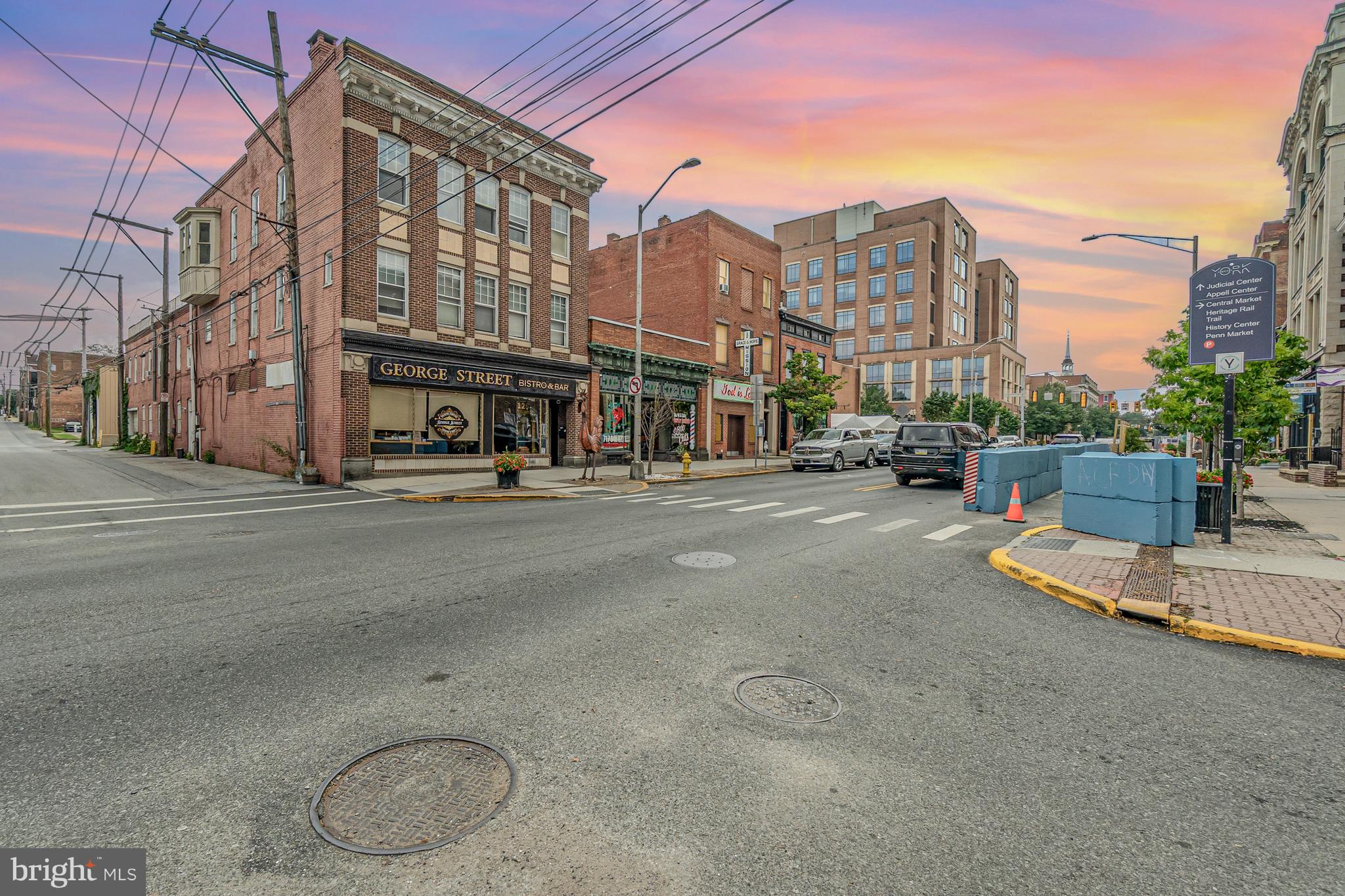 Huge potential here! Current use is multi-family. With over 6000 sq ft!! This building has so much potential for a true multiple unit dwelling. Several bedrooms with kitchens and baths on each level. Currently set up as one living space on second and third floors, a sanctuary on the main level and a full basement as well as a two car garage in the back of the building.