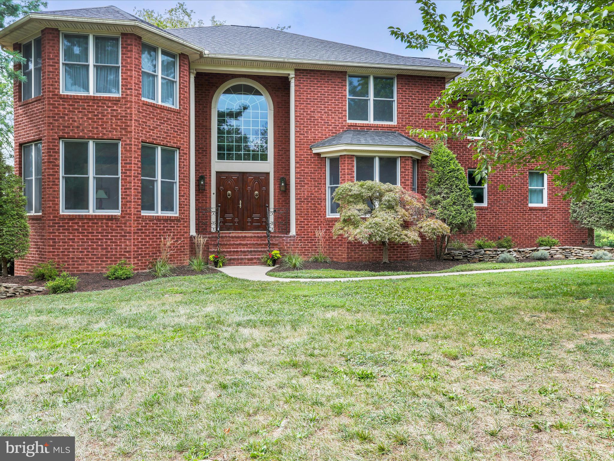 This completely custom-built, all brick home, is the perfect backdrop for those seeking luxury and space. Step inside the double front doors to the dramatic entryway. With an open balcony, hand-crafted grand staircase and a stunning mural (hand-painted by a local artist), this space gives new meaning to the phrase “making an entrance”. The sprawling first floor is accented by beautiful built-ins, recessed lighting and an open floor plan. Perfect for entertaining. The heart of the home is the bright kitchen, featuring updated countertops, island and adjoining breakfast nook, complete with custom bench. These flow directly into a large family room, outfitted with a beautiful marble mantle and wood burning fireplace. Looking for the best room in the house…look no further. The sunroom, directly off of the family room, is sure to be a crowd favorite. With a two-story ceiling, huge custom windows, tons of light and a balcony overlooking the private oasis of a yard, this room is sure to please, in all seasons. The main floor rounds out with a formal dining area, library, private bedroom/office, laundry room and powder room. The oversized 3 car garage offers additional storage space and is heated to ensure climate control. As you move upstairs you will be greeted by 3 bedrooms, 2 of which are oversized owner’s suites. The primary owner’s suite is adorned with a sitting room, expansive walk in closet and huge bathroom, complete with new LVP flooring. The soaking tub and 7x13 shower are custom features that will be enjoyed by all. Downstairs you will find a finished basement, terrific for entertaining, playing or use as an in-law suite. Complete with a kitchen and bar, this space is sure to check all the boxes. In addition to the large main room, the basement boasts 2 additional “flex” rooms, storage/utility room and full bathroom. Beautiful glass doors open directly out to the beautifully private .96 acre lot (a rare amount of acreage within a neighborhood). The yard, complete with shed and recently paved driveway, are additional highlights to this amazing home.
Recent updates to the home include an asphalt shingle roof – 2023, a water heater – 2024, 2nd floor HVAC – 2018, oil furnace - 2023, driveway repaved – 2025 and septic last pumped in 2025
This home offers something for everyone. Enjoy being on a quiet cul-de-sac, with a private yard (backing to Terrhane Community Park) – all while being minutes to all conveniences and commuter routes.