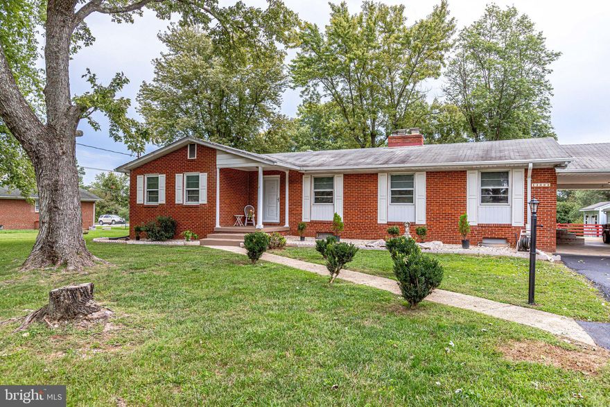 You will not want to miss this amazing opportunity in Lakeview Estates. This all brick rambler with finished lower level on almost a half acre features 3 bedrooms and 3 full and one half bath. Main level features hardwood floors, 2 fireplaces ( 1 wood burning and 1 gas ), and new LVP kitchen floor. New front doors. Primary en suite bath beautifully updated. Finished lower level features kitchenette, full bath, 2 bonus rooms, family room, plenty of storage and walk up entrance. The lower level could easily be a separate apartment. Roof 10 years old, outside AC unit 5 years old, inside furnace and HVAC unit 3 years old. 3 car carport and brand new driveway with parking for 6 plus vehicles. 2 storage sheds both with electric. Larger shed has AC and ceiling fan for the perfect work shop set up. Verizon FIOS and public water and sewer. NO HOA. Home needs some updates but is in move in condition. Sold “AS IS”. Come fall in love!