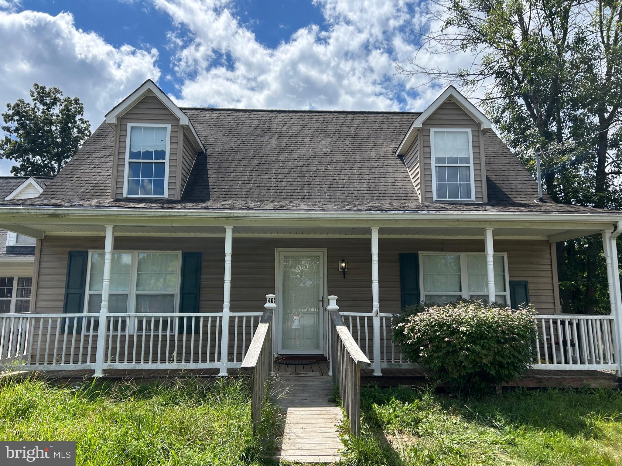 Built in 2005, this 3-bedroom, 2-bath Cape Cod in the heart of Wardensville offers a wonderful layout and plenty of potential to make it your own. The main level features a comfortable living room that flows into an open kitchen and dining area. The main level also offers the convenience of a spacious bedroom and full bath. Bedroom could easily be converted into a second living room as it has a spacious setting room. Upstairs, you’ll find a versatile open space, perfect for a playroom, office, or reading nook. Flanked by two generous bedrooms with walk-in closets and a shared full bath. Enjoy a fenced backyard, outbuilding for extra storage, as well as front and rear porches for outdoor living. This home features newer stainless steel appliances, along with high speed fiber optic internet. Located just 2 hours from the DC metro area and minutes from the shops, farmers markets, and restaurants of quaint Wardensville, this home blends small-town charm with great possibilities. Schedule your tour today!