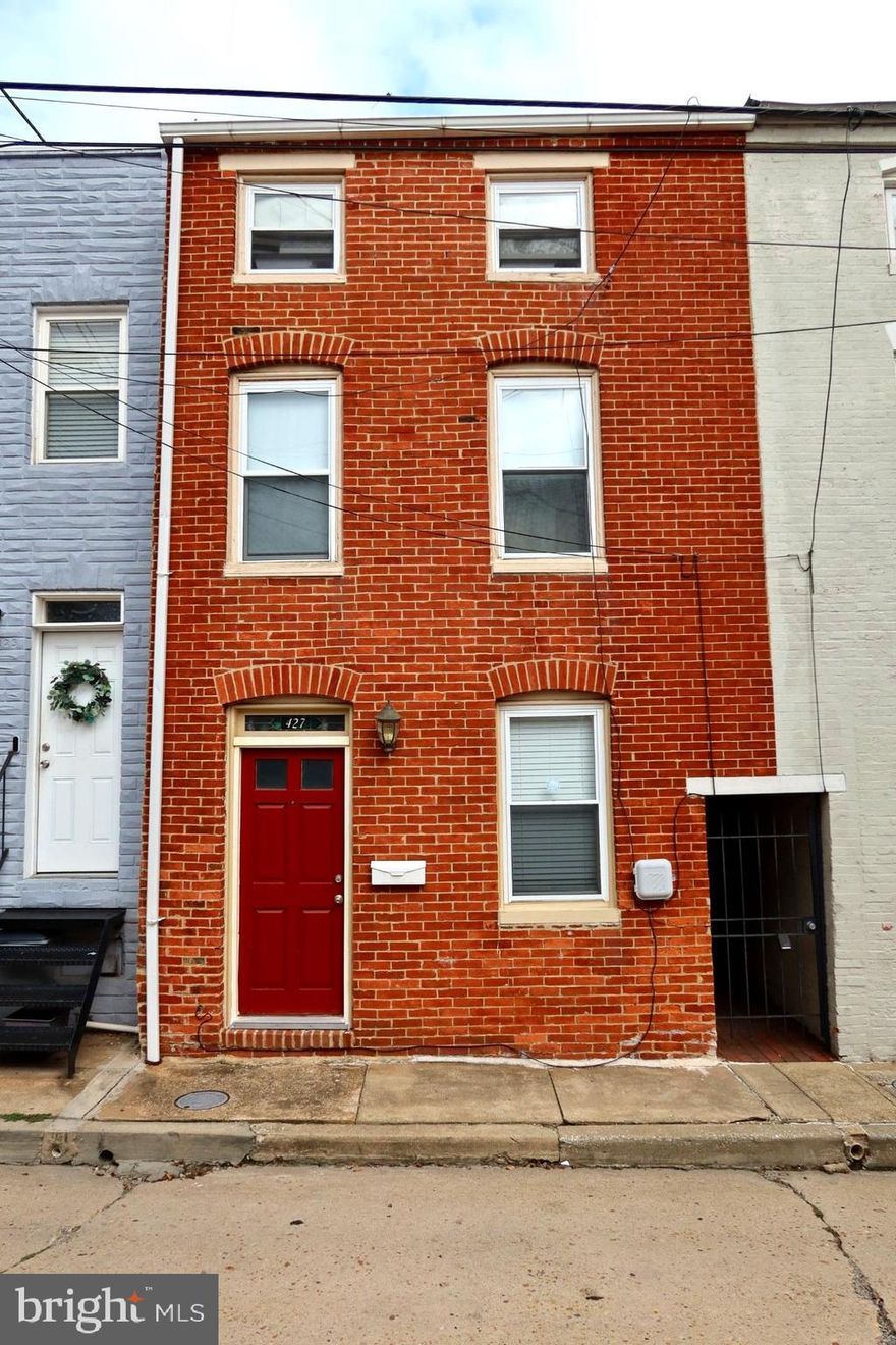 ***Back on the market*** — previous buyer had a change of heart. Their loss is your opportunity!!
Welcome to 427 S Durham Street!
Nestled in the heart of Baltimore’s historic Fells Point District, this charming 2-bedroom, 1.5-bath townhome perfectly blends classic character with modern comfort. Built in 1890, the traditional brick façade opens to a warm, inviting interior designed for today’s lifestyle.
At the heart of the home is the brand-new 2025 kitchen, complete with 2022 appliances—including a refrigerator, stove, and dishwasher—making everyday living and entertaining a breeze. A stacked washer and dryer add convenience to your daily routine.
The second floor offers a versatile living space that flows seamlessly to a private deck and patio, ideal for relaxing or hosting friends. Upstairs, the third level features a spacious second bedroom and a loft-style office, perfect for working from home.
With 999 sq. ft. of thoughtfully designed living space, this home is as functional as it is charming. Step outside to experience the neighborhood’s unique energy—cobblestone streets, harbor views, boutique shops, and some of the city’s best dining are just moments away.
****Home is being sold AS-IS***
2-10 home warranty is transferable for the new owners!!!! 
Don’t miss your chance to own a piece of Baltimore history in one of its most vibrant communities—schedule your showing today!