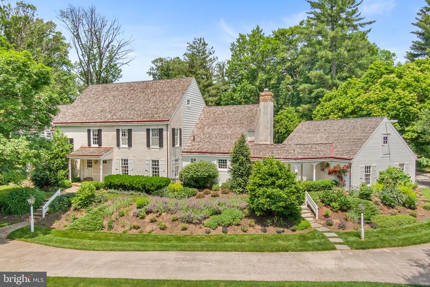 Nestled on a tranquil cul-de-sac in Easttown Twp. 363 Pond View Road in Devon offers both timeless elegance and modern comfort in this stately farmhouse with front circular driveway and manicured gardens and lawn.   From its commanding exterior presence to its meticulous craftsmanship both inside and out, this residence exudes an air of sophistication and charm that is sure to captivate discerning buyers seeking the epitome of luxurious country living.
As you approach the property, the classic farmhouse facade, adorned with a welcoming front door with authentic hardware and bubbled glass evokes a sense of nostalgia and grandeur. The expansive one-acre lot offers ample space with mature trees and lush lawn, picturesque views and a rear yard in-ground pool and spa.  Stepping inside, to a large and welcoming two-story foyer with side wrap around staircase and balcony above.   On one side find the formal step-down living room with deep window wells, a wood burning fireplace and hearth surrounded by beautiful built-in bookshelves and rear sliding door to stone patio and in-ground pool/spa.  The dining room is expansive and can hold the entire family and friends for those special holiday dinners.   The foyer offers, two coat closets and a formal powder room.   From the foyer enter the first-floor office/study with more built ins and rich wood tones for today’s home office suite.   The kitchen is a gourmet delight with double oven, large cooktop, subzero fridge, granite countertops, under cabinet lighting and pantry.  The breakfast area offers a large bump out wall of windows and door to rear deck.  This is open to a dramatic two-story great room with a stunning stone hearth with window and gas fireplace.   The two-story room features barn beams, sky lights and loads of afternoon sunshine.   To complete this level of living there is a large brick floored mudroom, laundry room and a second powder room. The mudroom leads to a beautiful breezeway to an expansive 3 car garage with pull down stairs for storage above.    
Upstairs, the luxurious primary suite awaits, offering a serene retreat from the stresses of daily life with fireplace and beautiful views all year round. Complete with a spa-like ensuite bathroom and two custom walk-in closets, this private oasis ensures rest and rejuvenation. Three additional well-appointed bedrooms and two full bathrooms provide comfort and convenience for family and guests alike.   There is a walk-up fully floored attic space for storage.  The lower level is full and partially finished for kid fun or hang out with walk out bilco doors to rear yard access.   
Located in the highly sought-after suburb of Devon, this residence offers the perfect blend of privacy and convenience. Extras include a full house gas generator, alarm system, inwall speakers and sound, two zone heating & air.  Within this private HOA community there is access to the community pond.
With its timeless quality and design, luxurious amenities, and serene setting, 363 Pond View Road epitomizes the best of main line living in the award-winning school district of T/E! This special opportunity awaits – showings to begin June 13th.