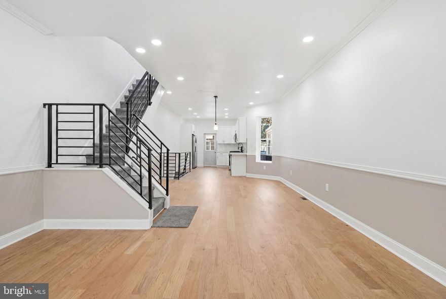 Stunning and fully permitted 3 bedroom and 2 full bathroom townhome now available. Upon arrival, you'll notice a well kept block, front porch and ample street parking on the exterior. From there, a free flowing open concept boasting all natural light, modern kitchen, dining and living room combination on the main level. Next, 3 large bedrooms, full bathroom and tons of closet space upstairs. And finally, a finished basement and full bathroom perfect for entertaining friends and family. Could it get any better though? It does! This home also has a new HVAC system, plumbing, electric and appliances throughout. In addition, it's near all the public transportation and major transit you need to make the commute a breeze so make your appointment today before it's too late!