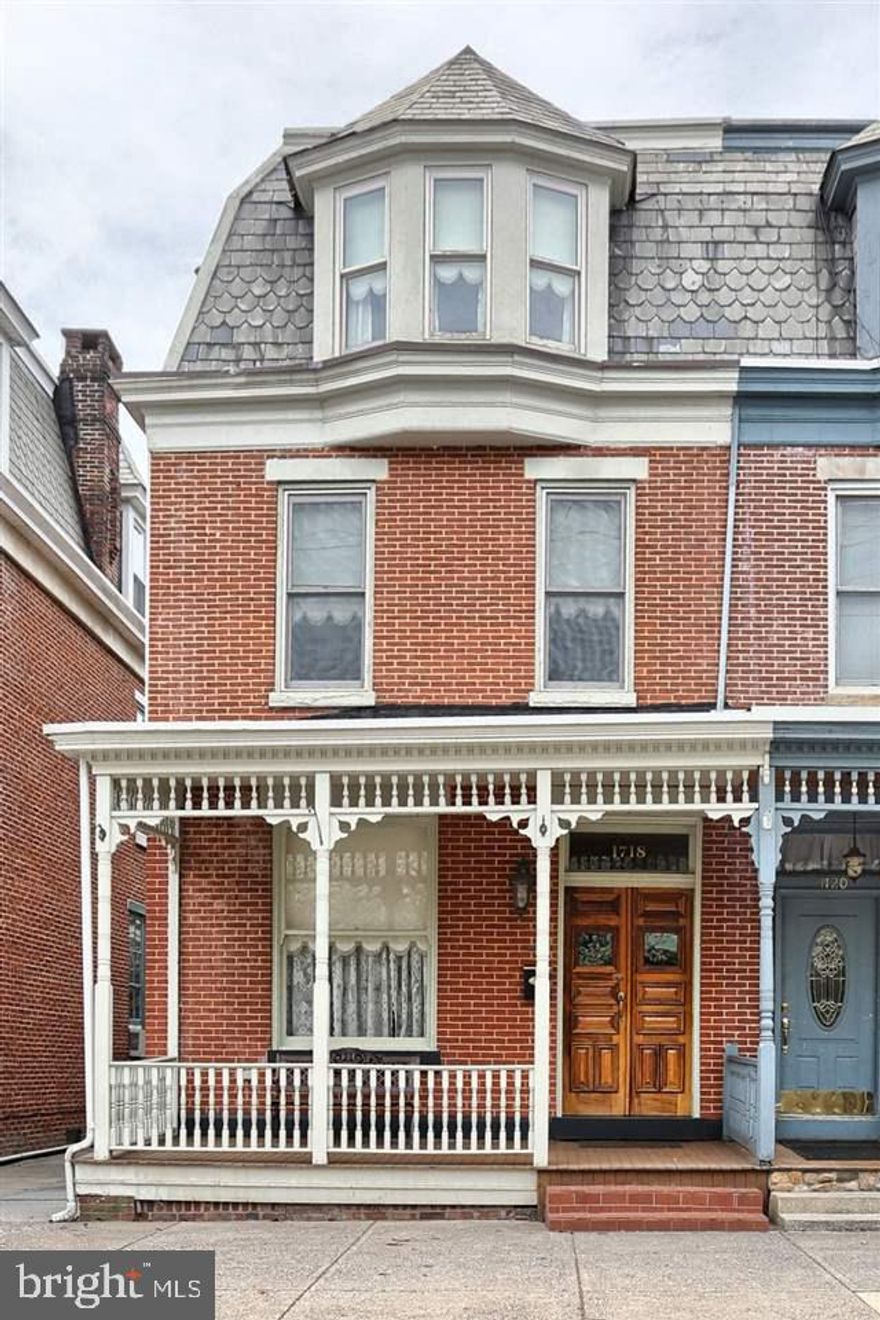 Original historic charm and character beautifully updated with exposed brick from 1st to 3rd floors, renovated kitchen with maple glazed cabinets, granite counter tops, and slate floor. Two spacious master suites with walk-in closets. Original hardwood floors under new hardwood flooring. Wrap around porches with mahogany floors overlook private, fenced paved courtyard. No detail has been overlooked in making this home a showplace from the bathrooms to the light fixtures. This is a home to be proud of.