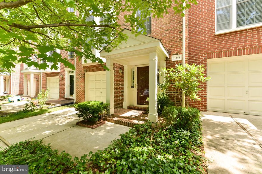 Stunning 3-levels of hard wood floors with 1 car garage. 3 large master bedrooms (2 upstairs with cathedral ceilings) each with on-suite bathrooms. Open floor plan.  Eat in kitchen with granite, island, gas cooktop, bay window.  FP.  Deck.  Fenced yard.  Amenities: pool, courts, tot lots, ponds, trails. Walk to Wegmans, Fairfax Corner, Whole Food, XSport Fitness. Across from Park! Woodson pyramid.