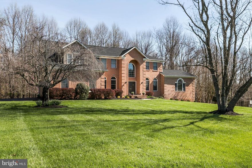 All offers considered.Multi-generational home w/ private lock-out apt on main level.Features:striking entry,spacious LR w/built in cabinetry,beautiful DR w/wainscoting,Family Room w/fpl,sleek white kitchen,10' ceilings,wood fls,accent/recessed lighting,custom window treatments,sumptuous Master BR/BA,great closets,large patio,2 car garage,gorgeous lot.$5,000 agent bonus w/ratified contract by 8/31.