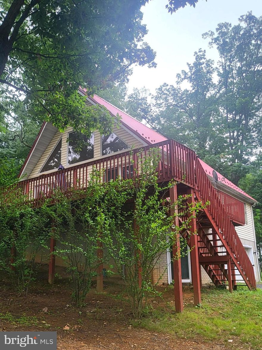 PRICED UNDER RECENT APPRAISAL !! BACK ON THE MARKET AT NO FAULT OF SELLER! BUYER FINANCING FELL THRU! Ready for new owners! 
*Neighborhood surroundings WITHOUT the HOA! A-Frame home on .89 acres in sought after Falling Waters! Main level is open with kitchen and family/dining room area and down the hall you will find 2 bedrooms and 1 full bath. Upstairs is unfinished but could be finished into a large master primary bedroom, game room, it is your canvas to finish! Downstairs you will find the 3rd bedroom. This home has a tin roof and a 2 car basement garage. With some TLC, this home has many possibilities!