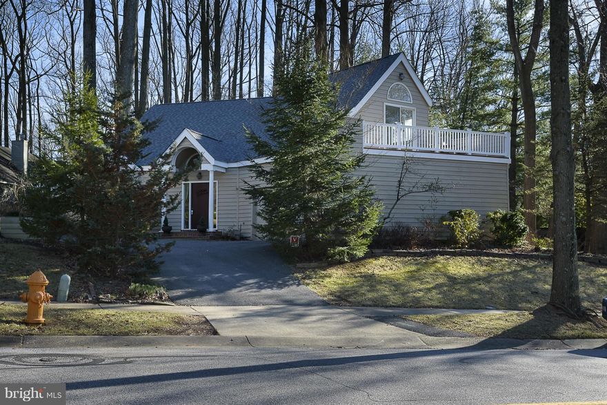 Unique 2 story featuring a 1st floor guest room or in-law suite w/updated Full Bath and 4 bedrooms up. Master has 16ft his and her walk in closet and Master bath has steam shower, separate soaking tub plus deck! Stainless Steel appliances and gas cooking. Gas FP w/ 20ft fieldstone wall, 2nd floor laundry, 2 zone HVAC. Don't miss the 7ft wet bar, "secret playroom". Private backyard/fish pond- Nice!