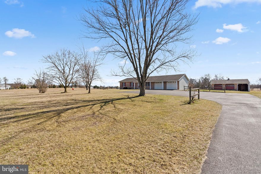 Land is a limited commodity—and finding a home nestled on 5.8 unrestricted country acres with no HOA is a rare opportunity. Welcome to the perfect blend of privacy, space, and one-level living. This charming brick rancher offers easy main-floor living with 3 bedrooms, 1 full bath, an updated kitchen with stainless steel appliances, and a dedicated dining room. The partially finished full basement provides additional living space, while the unfinished side is ideal for storage or future expansion. Step outside and imagine the possibilities: a covered concrete pavilion with electric—perfect for transforming into a screened 3 season room, an outdoor kitchen, or an open-air entertaining space. The property also features a 3-bay outbuilding with electric, offering incredible storage for equipment, tools, or hobby space. As an added bonus, you’ll find three additional sheds, including one with electric—ideal for extra storage or even your dream “she shed.” Parking is never an issue with a 2-car attached garage, expanded parking pad, and extended driveway—plenty of room for guests, gatherings, and all your vehicles. Nature lovers will appreciate the beautiful chestnut, peach, and Asian pear trees that accent the landscape, adding charm and seasonal enjoyment throughout the year. This property offers the freedom of country living with the convenience of one-level comfort and endless potential. Schedule your appointment today and discover everything this unique home has to offer.