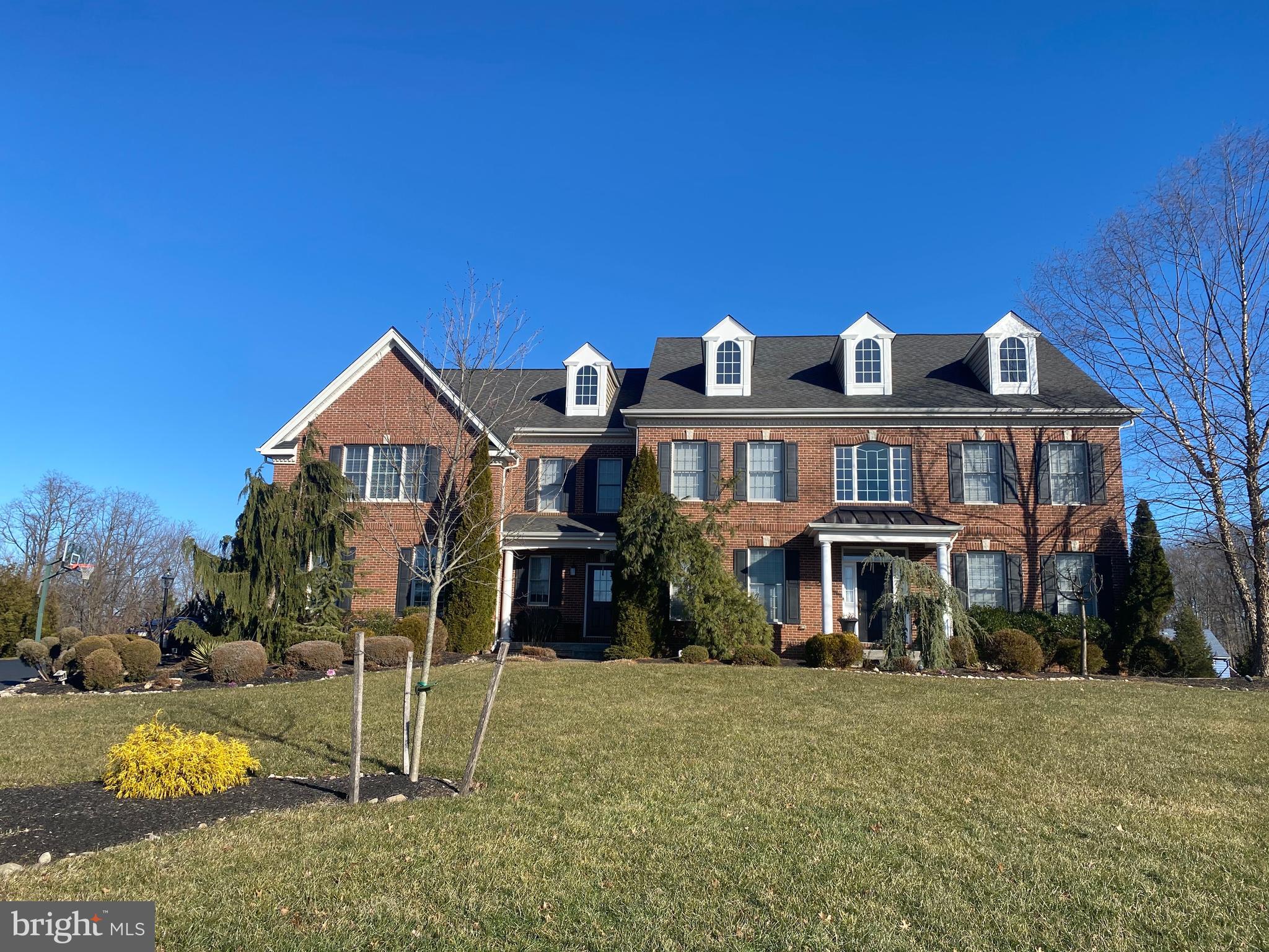 This one of a kind Estate home is a must see! Welcome to 9 Hillview Dr, a remarkable 5 bedroom, 3 full, 2 half bath home on a premium cul-de-sac lot in the highly sought after Foxhall Estates. Enter in through the main front door where you are greeted by a grand 2-story foyer where you will immediately notice the graceful turned staircase with open landing along with the exquisite wood trim and wainscoating throughout. The foyer is flanked on either side by a formal living and dining area elegantly decorated and featuring hardwood floors in pristine condition. Past the foyer is the Eat-in chef's kitchen that boasts custom cabinetry, granite countertops, stainless steel appliances and a high top bar counter perfect for entertaining. The sunlit family room features soaring ceilings and a massive fireplace with an ornate wood facade. There is a convenient powder room right off the family room. The basement is completely finished with vinyl plank flooring and an oversized bar area - making it the perfect area for hosting any type of family gatherings. With all the added finished space, it also allows for a full fitness area. Continue your tour up to the second floor which hosts 5 bedrooms and 3 full bathrooms. The luxurious main bedroom suite highlights the spacious retreat for the new homeowner. This room is outfitted with two walk in closets, a seating area and 4 piece bathroom with a dual vanity. The additional generous oversized bedrooms provide ample closet space and plenty of natural sunlight. Wrapping up your tour in the backyard you will notice the breathtaking scenic views from your paver patio. Other additional highlights of this home are the 3 car garage parking, walk out basement and 3 zone heating and cooling. Do not miss your chance to view this meticulously maintained home and make it yours.