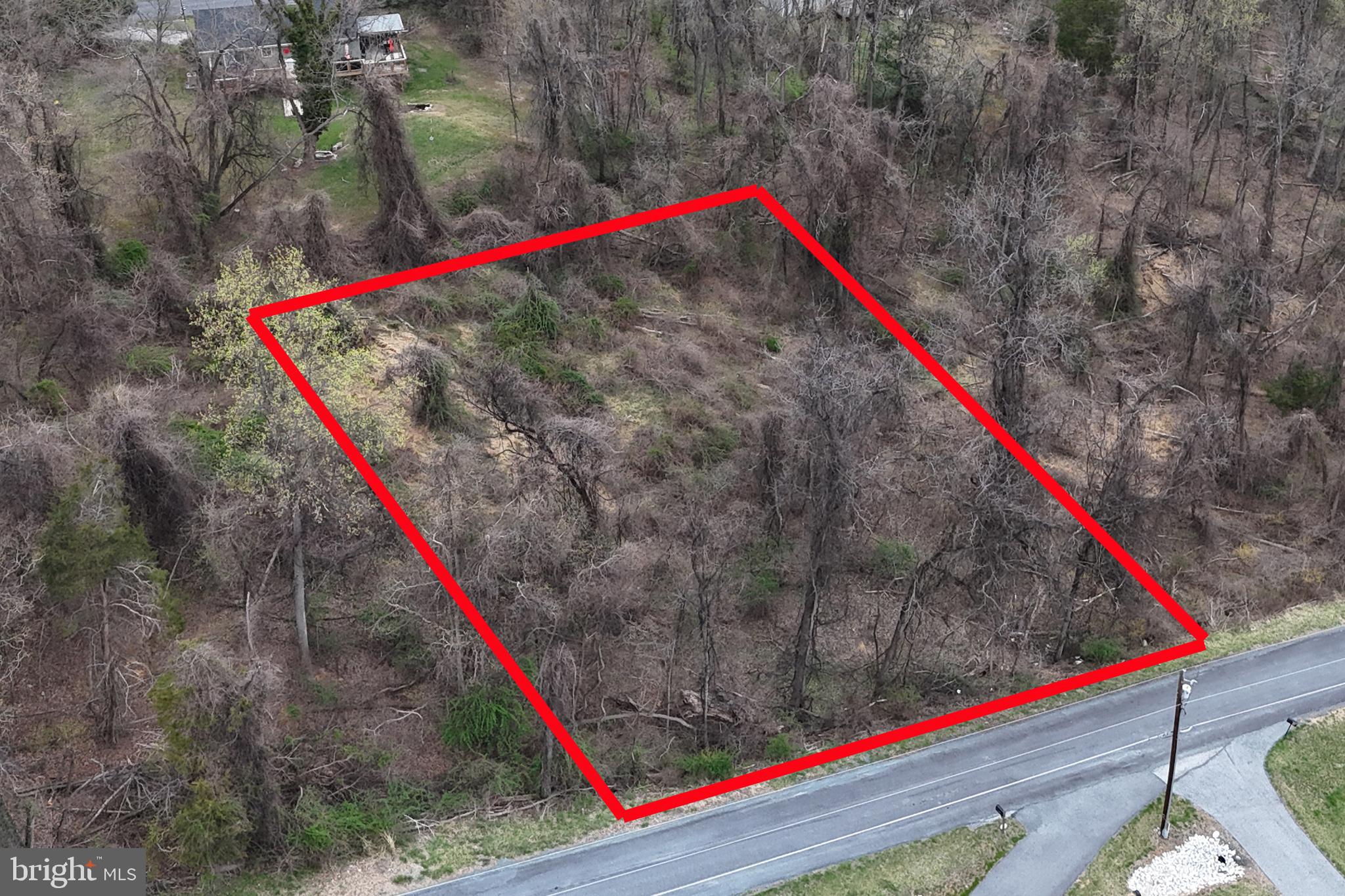 Great 0.46 acre building lot in Carroll Valley with approved perc test and ready to build. Slopes to the east, ideal for a side walk-out and/or side loading garage. Orange flags mark the approximate front corners