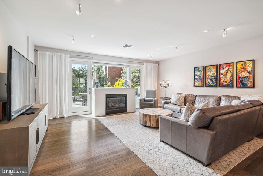 Welcome to 1424 Bainbridge! This 20 foot wide, 4 bedroom, 3 and a half bath home in a gated
community, with a huge finished basement, patio, roof deck, and 2 car garage parking truly has
the best of luxury city living! Having a home in the Artisan Community means you have all the
convenience of living in the heart of the city with the security of the gated courtyard, parking,
and added outdoor space. The main level features an open concept kitchen, dining room, and
living room with custom stained hardwood floors that run throughout the home and a gas
fireplace that leads out to the spacious deck with tree top views of the courtyard. The kitchen is
a chef’s dream with stainless steel appliances; including a Sub Zero refrigerator, Wolf range,
Bosch dishwasher, and a wall mounted oven with microwave. There is plenty of room on the
large island and custom buffet to cook, prep, and entertain, and ample cabinetry for storage.
There is also a powder room on this floor. Upstairs is a large Primary Bedroom suite with a
walk-in closet and built-in dresser, and a spa-like bathroom with custom cabinetry, glass
enclosed shower, and double vanity. This level also has two bedrooms with custom closets,
hallway storage, and a recently updated full bath with bathtub/shower combo. On the ground
floor is a bedroom that is perfect for a guest suite or office, a full bathroom, laundry closet with
side-by-side washer and dryer and the entrance to your two car garage! Downstairs is the huge
basement with high ceilings, built-in wine storage, and even more storage in two large closets.
The cherry on top of this incredible home is the gorgeous roof deck with green roof and amazing
views of the city. The prime location makes this house accessible to all the best of Center City.
Walk to restaurants, shopping, Rittenhouse Square, parks, and playgrounds, or easily hop on
public transportation. Set up your showing today!