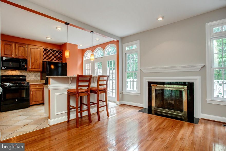 Stnley Mrtin TH on quiet culdesac in hrt of Tyson s. <2 mi 2 slvr & ornge line. Exclsve enclave of charming THs w/vrty elevations. Redesigned opn Grmt KIT w/grnite counntrps, islnd w/bfast bar, off fam rm. Hdwds thrghout mn lvl w/tile in KIT/BA, vaultd mstr, mrble fyer & pwr rm, extnsve mldings, 2 FPs, 2person Jacuzzi tub, 9  ceilings, oversized dck, lwer lvl wlk-out 2 fncd yrd, lot bcks to trees.