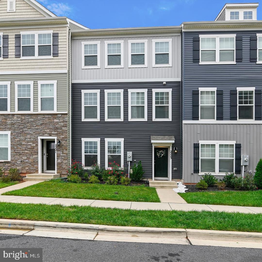 Welcome to 2223 Pagefield Way! An immaculate, like-new townhome nestled in a pristine community, this home epitomizes modern comfort and style. The open-concept layout enhances the sense of spaciousness, creating an inviting environment for residents and guests alike. The modern kitchen is the heart of the home, characterized by 42-inch cabinets, stainless steel appliances, granite counters, custom backsplash, and island with seating. The primary bedroom provides a calm sanctuary with large windows, custom closet organizers, and primary bath with dual sink vanity and shower. Two additional bedrooms, hall bath, and fun laundry room make the upper level complete. The spacious main level family room provides a perfect spot for flex space. Enjoy the rear deck to relax and unwind. The two-car garage is equipped with an EV charging station and the driveway provides ample parking. Situated close to commuter routes, it offers both convenience and tranquility for its residents. Just minutes to Ft. Meade, NSA, and BWI.