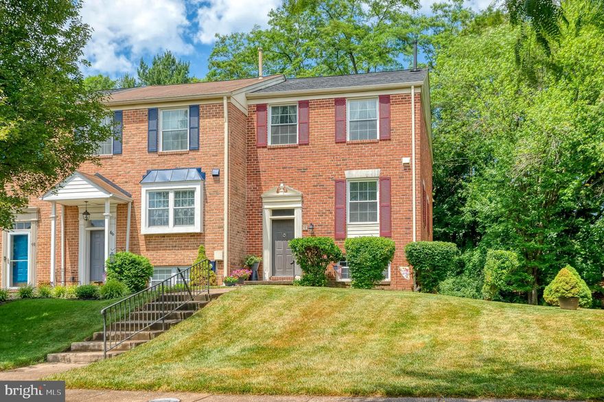 Welcome to the lovely and rarely available community of Dulaney Springs/Silver Lake!  This spacious 4 BR, 2 full/2 half bath all brick end-of-group townhome has been lovingly maintained by the original owners!  Features include freshly painted eat-in kitchen w/black appliances; open concept living/dining room w/wood laminate flooring, wood burning fireplace.  Awesome deck off the LR to relax while enjoying the beautiful  & private rear wooded views.  The upper level offers three roomy bedrooms w/new Bath Fitter shower & double closets in the primary BR, & new Bath Fitter shower in guest bath.  The finished lower level boasts a 4th bedroom, powder room, & family room w/sliders to patio and back & side yard.  Roof 2015, some replacement windows 2019, HVAC 2021.  Plenty of parking for guests!  Convenient location near shopping, dining, & schools.