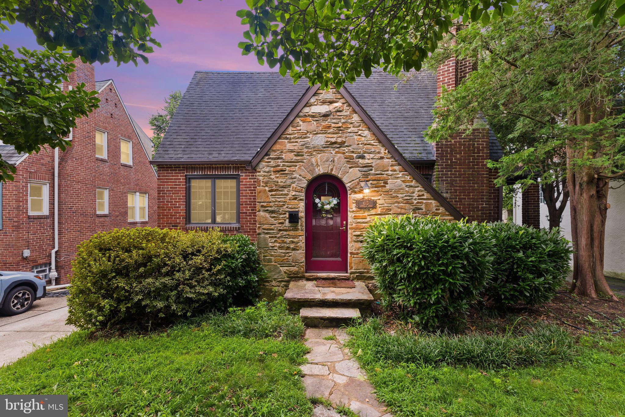 Welcome to this charming historic Tudor in Baltimore’s beloved Anneslie neighborhood.
A mature magnolia tree graces the front yard, offering a touch of natural elegance and seasonal beauty. This home blends timeless character with modern comfort, boasting over 2,600 sq ft of living space. Adorned with classic original doors, rich wood floors, and a grand stone fireplace in the living room, it leaves little to be desired.
A screened porch off the kitchen is ideal for alfresco dining or quiet relaxation (hold the bugs, please!), seamlessly extending the living space. Imagine enjoying casual moments on the side porch—perfect for socializing or savoring a peaceful morning coffee.
The entire upper level is dedicated to an expansive primary suite featuring a private bathroom, home office, sitting area, and walk-in closet—perfect for working from home or curling up with a good book. With a full bath on every level and central AC, this home offers the perfect blend of distinctive Tudor architecture and thoughtful modern convenience.
Recent Upgrades:
A brand-new boiler was installed just 3 months ago, and the water tank was replaced within the past year, ensuring worry-free functionality.
Nestled in the Anneslie Historic District—established in the early 1920s and known for its scenic tree-lined streets and classic charm—this home offers both community serenity and convenient access to schools, shopping, and Baltimore/Towson commuter routes.
613 Anneslie Road is a rare opportunity to own a character-rich Tudor with modern amenities and timeless appeal. With its grand primary retreat, inviting indoor-outdoor flow, and recent upgrades, it’s a home that meets today’s lifestyle needs while honoring its historic roots.
*Selling As-is*
