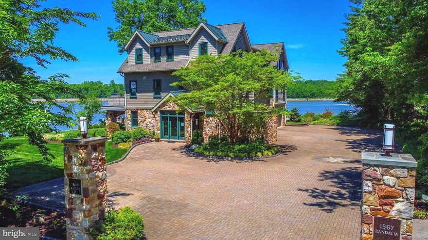 Welcome to an extraordinary waterfront sanctuary where the C and D Canal, Back Creek, and the Elk River merge, creating an idyllic backdrop for this unparalleled custom-built masterpiece. This one-of-a-kind, state-of-the-art home boasts meticulous craftsmanship and no expense spared.

The exterior of the house is adorned with natural 6" stone, enveloping the entire ground level in an elegant embrace. The attention to detail extends to the functionality of the property, with a 646k BTU Generac Quiet Source propane generator providing uninterrupted power to the entire house. The roof boasts both 50-year shingles and steel sections, ensuring durability and longevity.

Step outside and embrace the waterfront lifestyle. The property features a private boat ramp, granting you seamless access to the shimmering waters. Over 30,000 pavers, carefully arranged in a custom compass design, lead the way to the water's edge.  There are three decks—an expansive large deck, a cozy small deck, and a convenient side deck.

Indulge in the elegance and comfort found indoors. Pella windows and doors, with UV protection, grace every corner, inviting natural light and offering picturesque views of the surrounding waters. The 8-zone heating and air conditioning system ensures optimal climate control throughout the home. Casablanca brand ceiling fans provide both functionality and aesthetic appeal.

Stainless flood gates safeguard against inclement weather. Sapele trim accents the 8" baseboards, adding a touch of sophistication. An Otis elevator conveniently transports you to all three floors, allowing for effortless movement throughout the home. The heart of the home lies in the gourmet kitchen, which features custom cabinets, granite countertops, and a walk-in pantry. Experience the perfect harmony of entertainment and relaxation in the spacious theater room, complete with state-of-the-art insulation for superior sound quality. A custom-built wet bar adds a touch of elegance, while two fireplaces create cozy ambiance on cooler evenings. 

Experience the epitome of waterfront living in this truly remarkable property. You are not buying a home, you are buying a way of life!