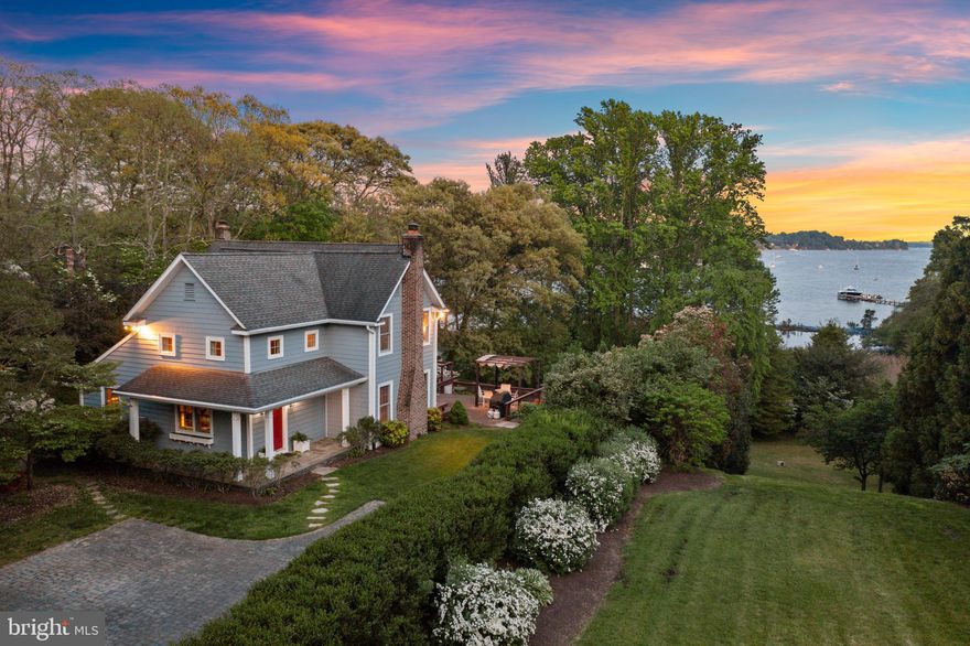 Nestled within the serene and coveted community of Olde Severna Park, this meticulously remodeled home, ideally sited at the end of a quiet road, offers a rare blend of timeless elegance & modern convenience. Originally built in 1915, this historic residence has been tastefully renovated to accentuate its charming features while showcasing breathtaking water views of Sullivan’s Cove just off the Severn River.  As you step through the covered entrance, you're greeted by a welcoming foyer adorned w/ custom built-ins, vaulted ceilings and transom windows, inviting natural light to dance throughout the space. The family room, boasting panoramic views of the Cove and featuring a cozy wood burning fireplace, seamlessly connects to the gourmet kitchen. Here, a spacious island, quartz countertops, & ample cabinetry await, along w/ a large walk-in pantry for added storage convenience.  Adjacent to the kitchen lies a versatile bonus room, which could be used as a mudroom or office nook, complete w/ built-in storage with seat and file cabinets, leading to the original cellar w/ a dedicated wine storage area. A built-in buffet provides a seamless transition from the kitchen to the formal dining room, adorned with original 1915 built-in china cabinets and offering captivating Sullivan’s Cove views through two glass sliding doors leading to the back patio. The dining room effortlessly flows into the formal living room, where you can relax by another wood burning fireplace & enjoy the tranquil scenery through dual sliders opening onto the back deck. The main level is further complemented by a meticulously hand-painted powder room, adding a touch of charm to this exquisite home.  Ascend the stairs to discover the upper level, which hosts three bedrooms & three full bathrooms. A tranquil full bathroom, illuminated by two skylights & offering serene water views, is next to one of the guest bedrooms & features a luxurious soaking tub.  The primary suite, boasting captivating water vistas & adorned w/ exposed beams, presents a haven of comfort and style. Dual walk-in closets offer ample storage space, while the updated ensuite bathroom showcases a glass-enclosed shower w/ pebble tile floors, chic tiling, & a vanity with generous storage capacity. For added convenience, the washer & dryer are thoughtfully situated adjacent to the primary suite.  Completing the upper level, the third bedroom is serviced by a third full bathroom, featuring a shower/tub combination for added functionality. To return to the main level, simply descend the original second set of stairs, maintaining the home's historic charm & character. The finished basement offers a wealth of possibilities as a recreational area, including abundant storage, a convenient half bathroom, and sliders leading to the backyard, extending the versatility and functionality of the home's living areas.  Outdoor living is equally enchanting, with a patio, multiple-level deck, and an inground pool all overlooking the picturesque Cove. Immerse yourself in the lush landscaping and stone pathways that surround the property, creating a tranquil oasis for relaxation and entertainment.  The property borders a Severn River conservation easement, ensuring that no future development will occur between the property & the water.  Enjoy a convenient path to the community beach on the shore of Sullivan’s Cove. Residents of Olde Severna Park enjoy exclusive access to a community beach on the Cove, a waterfront pavilion, clubhouse, two large piers, moorings and piling slips, a playground, kayak and dinghy storage, and seasonal community events, making it a truly desirable waterfront destination. Experience the epitome of water view living in this rare offering, where historic charm meets modern luxury amidst the serene beauty of Olde Severna Park. Note- there is an additional fee to join the Olde Severna Park Improvement Association to gain access to these amenities & a waitlist for boat slips/storage.