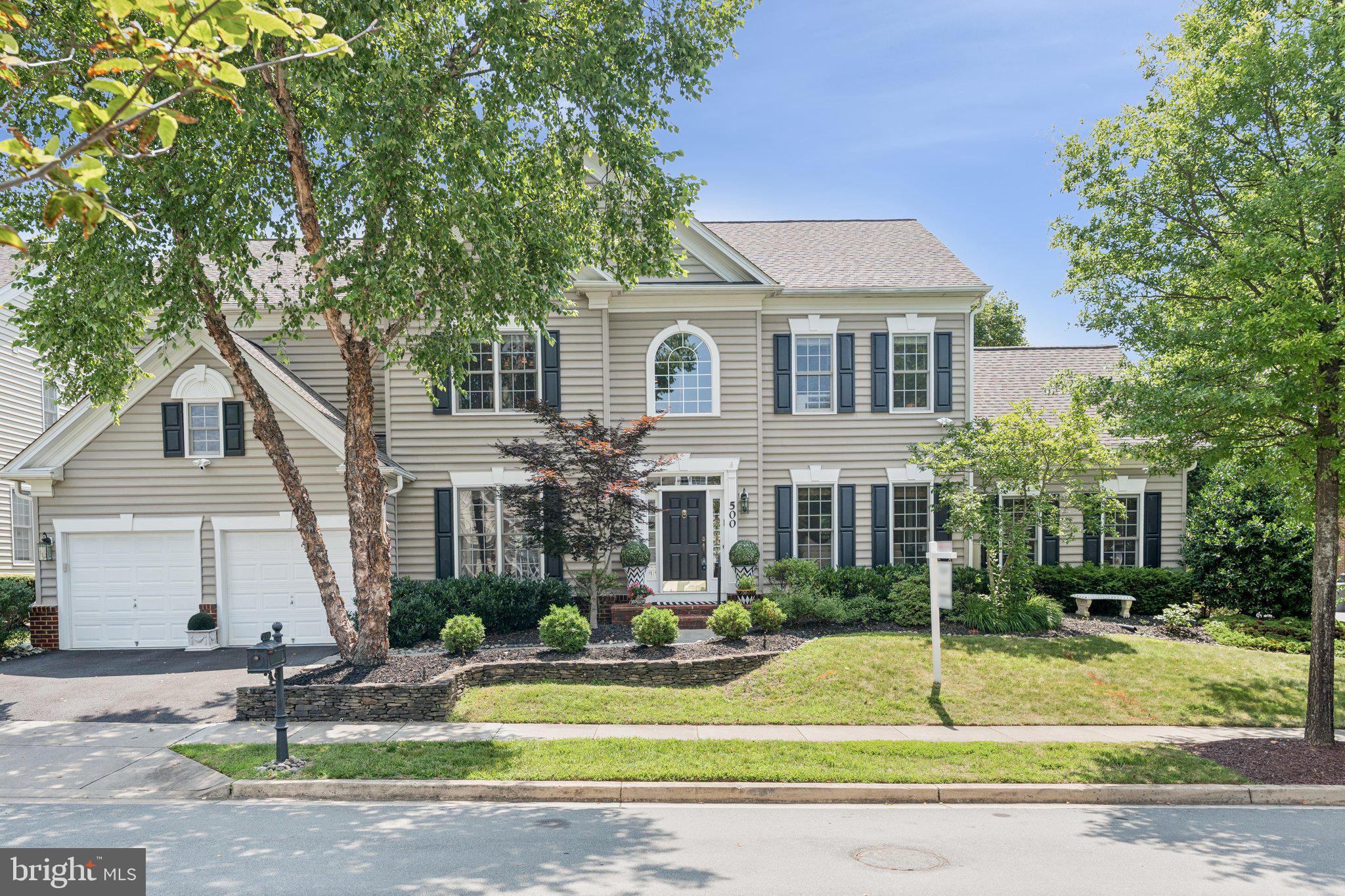 Stunning Colonial on a Corner Lot – A Must-See!
Welcome to this spacious and beautifully appointed colonial nestled on a desirable corner lot in the sought-after Fallsgrove community. This elegant home offers exceptional curb appeal with a decorative stone wall in the front yard, two-car garage, and private driveway parking for two additional vehicles.
Step through the front door into a gracious foyer with wainscoting and a view of the elegant staircase featuring brand-new carpet, wrought iron railings, and solid oak banisters. From the foyer, you’ll be drawn into a series of exquisitely designed living spaces perfect for both everyday comfort and grand-scale entertaining.
The formal living room is adorned with classic crown moulding and flows seamlessly into an oversized sunroom. Bathed in natural light from seven large windows, the sunroom features travertine flooring, French glass doors to the backyard patio, custom blinds and shades—currently configured as a sports entertainment haven.
To the left of the living room, the formal private dining room exudes sophistication with architectural crown moulding, wainscoting, custom window treatments and a new shade. This space easily accommodates seating for ten and connects to the kitchen through a charming dry bar display with glass cabinetry and granite countertops.
The recently updated kitchen is a chef’s dream. Outfitted with KitchenAid stainless steel wall double ovens, stovetop, dishwasher, microwave, and granite countertops, the space also features a generously sized island with counter height seating and generous table seating. Custom hand-painted and detailed white cabinetry by Mr. Faux adds character and warmth. Glass doors open from the kitchen to the expansive backyard patio, perfect for entertaining.
Off the kitchen, the inviting family room boasts a wood-burning fireplace and four large windows. Adjacent to this space is a private executive office overlooking the patio, complemented by elegant custom wallpaper, wainscoting, and a powder room. All doors in this area are finished with beautiful architrave door headers.
Upstairs, you'll find four spacious bedrooms and a large den. The primary suite is a luxurious retreat with tray ceiling, two walk-in closets, custom window treatments, Somfy electric shade, and plush carpeting. The spa-like primary bathroom features double sinks, an oversized soaking tub, large walk-in shower, private water closet, and stunning white marbleized tile.
Bedrooms 2 and 3 each include recessed lighting, generous walk-in closets, and private full bathrooms, with solid oak flooring continuing through the hallway. Bedroom 4 connects to a Jack-and-Jill bathroom that also serves a large den (no closet), ideal as a playroom, or guest space.
All bedroom closets are equipped with custom built-ins for optimal organization. In total, the home includes five full bathrooms and one half bath—each thoughtfully updated and tastefully appointed.
The fully finished lower level is an entertainer’s paradise and a haven for wellness and creativity. Enjoy luxury vinyl flooring, a mirrored yoga/Pilates studio area, an art bonus room nook with an enormous storage closet, an additional den, and another full bathroom. A massive utility/storage room features wood-framed shelving and bookcases.
Walk out from the basement to an expansive slate patio stretching the length of the home. Framed by mature privacy trees expertly trimmed to allow sunlight, the backyard offers three distinct areas for dining, lounging, and socializing—ideal for gatherings or quiet moments under the sun.
Walk to popular restaurants and shops at the Fallsgrove Village Center. Convenient to I-270, MD 200 (ICC), Shady Grove metro, Shady Grove Medical Center, Rio and Downtown Crown neighborhoods.
This extraordinary home combines timeless style with modern amenities, an amazing location, and room to grow. Schedule your private tour today!