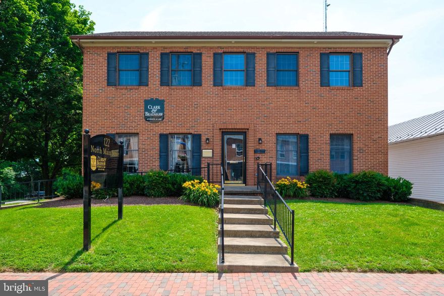 LEASE RATE: $14.80 PSF INCLUDES BASIC UTILITIES. Just over 1,200 SF of professional office space in the heart of Woodstock! This professional brick building home to the area's top legal and financial services businesses offers a versatile layout in a private suite, evenly split between a spacious open work area and private offices. With multiple entrances, the space is perfect for flexible access, directing client access or accommodating separate teams. Enjoy the convenience of abundant parking—including both on-street spaces and private off-street parking lot access for staff and clients. This suite has abundance of storage available as well. This prime location offers great visibility and easy access in a professional visible setting with Main St. signage. Available immediately, this office is priced to lease quickly and includes basic utilities, making it a cost-effective solution for your business. Additional space available within the building!