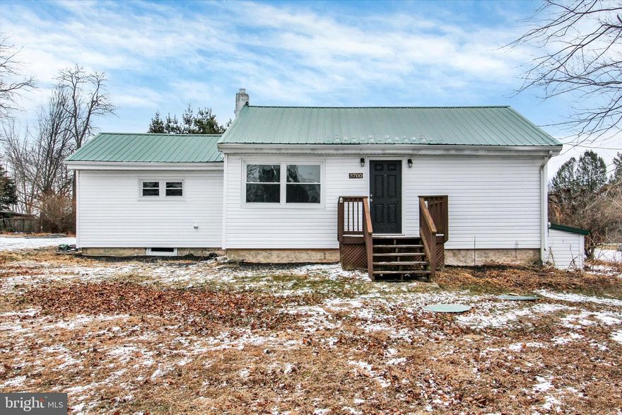 Welcome to Pennsylvania.  This home is located just above the PA line in Hanover PA.  It's a wonderful commuter location both north and south. Welcome to an affordable rancher with a lot to offer, move in ready and at an affordable price. This home features 3 Bedrooms and 2 full baths in a compact and cozy footprint.  The primary bedroom has its own full bath and a walk-in closet.  The home was completely updated in recent years and is move-in ready.  Everything has been painted and the carpets freshly cleaned.  The kitchen is modern and features white cabinets, Quartz Counters, SS appliances and LVP Flooring.  The laundry is conveniently located in a laundry closet in the kitchen.  There is Central Air and heat via an efficient Heat pump system.  There is a pergola just off the back door for warm weather relaxation. The flat and usable yard will have plenty of room for a garage in the future.  Come see this Gem today.